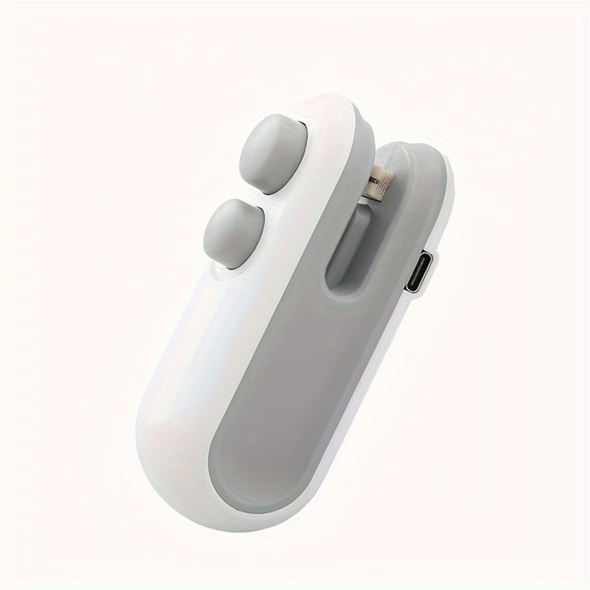 Ein weiß-graues Handgerät mit zwei grauen Tasten, einem Ladeanschluss und einem USB-Anschluss auf weißem Hintergrund.