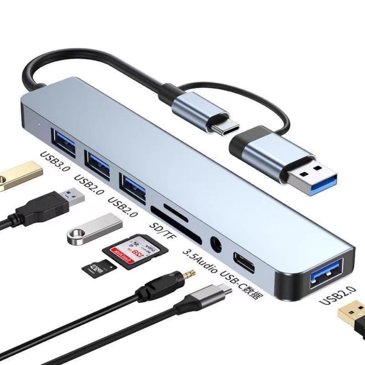Ein silberner USB-Hub mit mehreren Anschlüssen: USB 3.0, USB 2.0, SD/TF und 3,5-Audio. USB-C- und USB-Anschlüsse sind ebenfalls sichtbar.