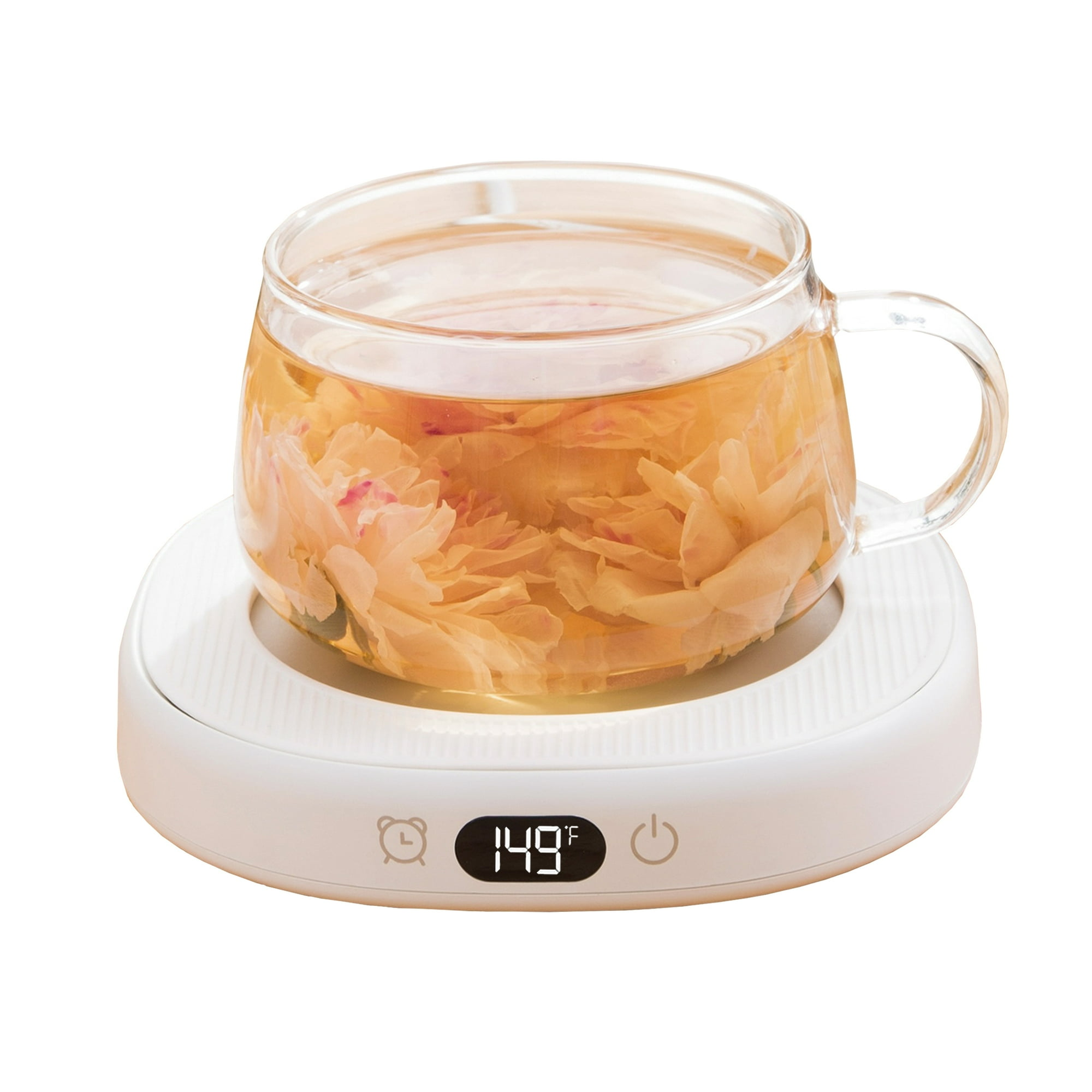 Ein klares Glas mit Tee und Blumen steht auf einem weißen Wärmer mit Digitalanzeige von 149°F.