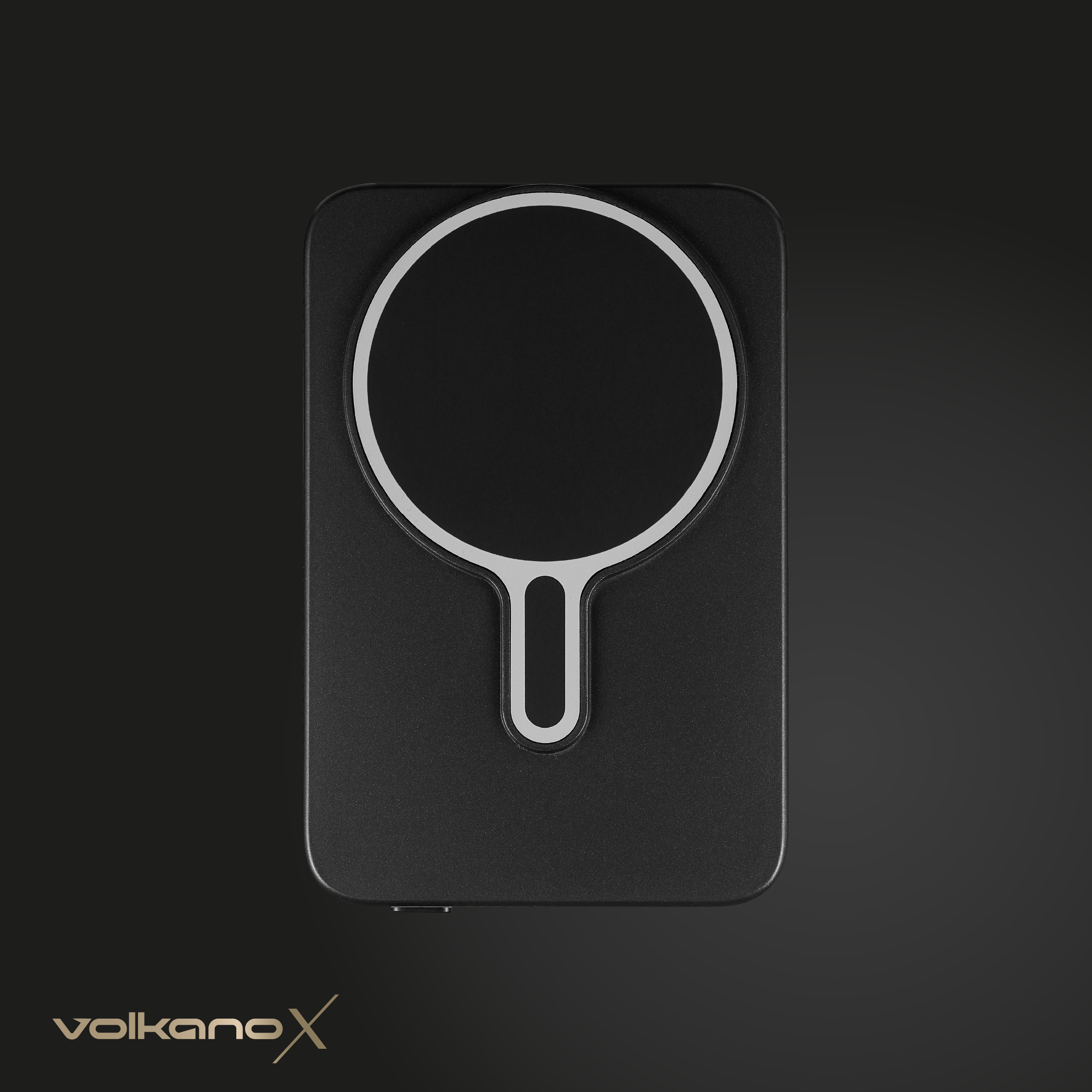 Ein schwarzes kabelloses Ladegerät mit weißem Ringdesign. Der Markenname 'volkanoX' steht unten.
