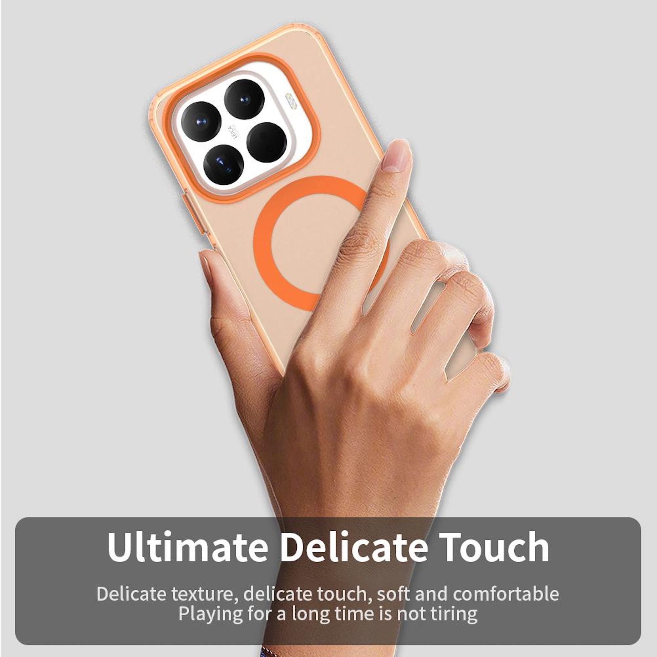 Eine Hand hält eine Handyhülle. Die Hülle ist transparent mit einem orangen Ring. Text: Ultimate Delicate Touch.