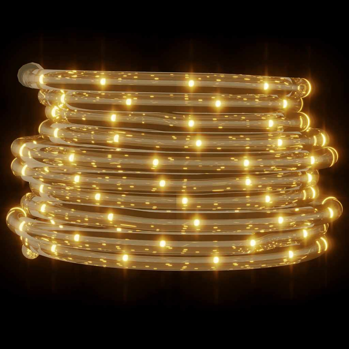 Eine aufgerollte Schnur mit warmweißen LED-Leuchten auf schwarzem Hintergrund. Die Lichter sind gleichmäßig verteilt und leuchten hell.