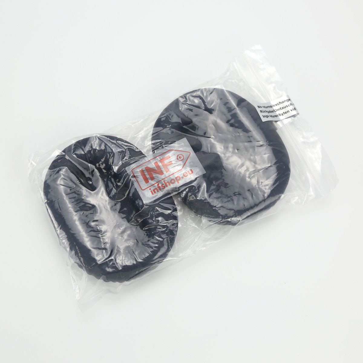 Zwei schwarze Kopfhörerkissen in einer Plastiktüte. Ein Etikett mit dem Text 'INF inkshop.eu' ist sichtbar.