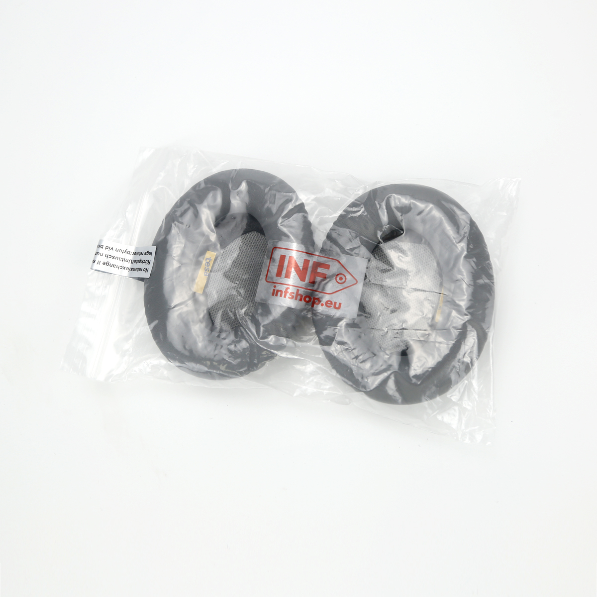 Dwie czarne poduszki do słuchawek w przezroczystej plastikowej torbie, z widocznym logo INF infshop.eu.