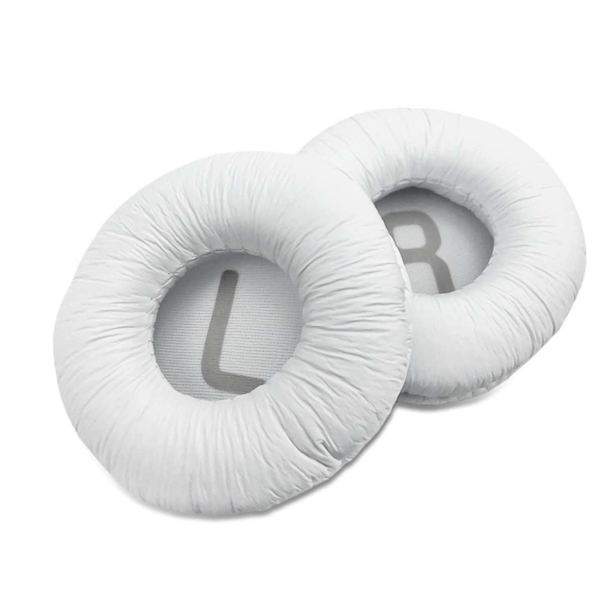 Dwie białe poduszki do słuchawek. Lewa ma 'L', a prawa 'R'.