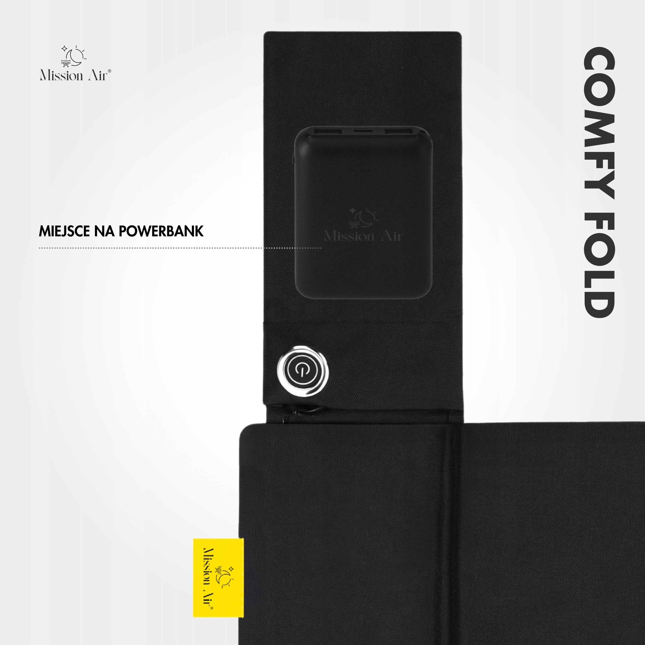 Czarny powerbank w czarnym uchwycie, białe tło, tekst 'COMFY FOLD' i logo 'Mission Air'.