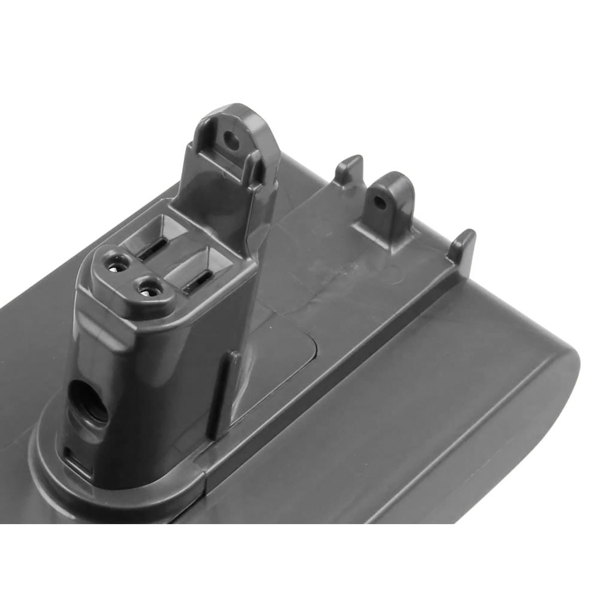 Primo piano di una base batteria grigia per aspirapolvere. Ha un corpo cilindrico con due fori e una base rettangolare con due sezioni rialzate.