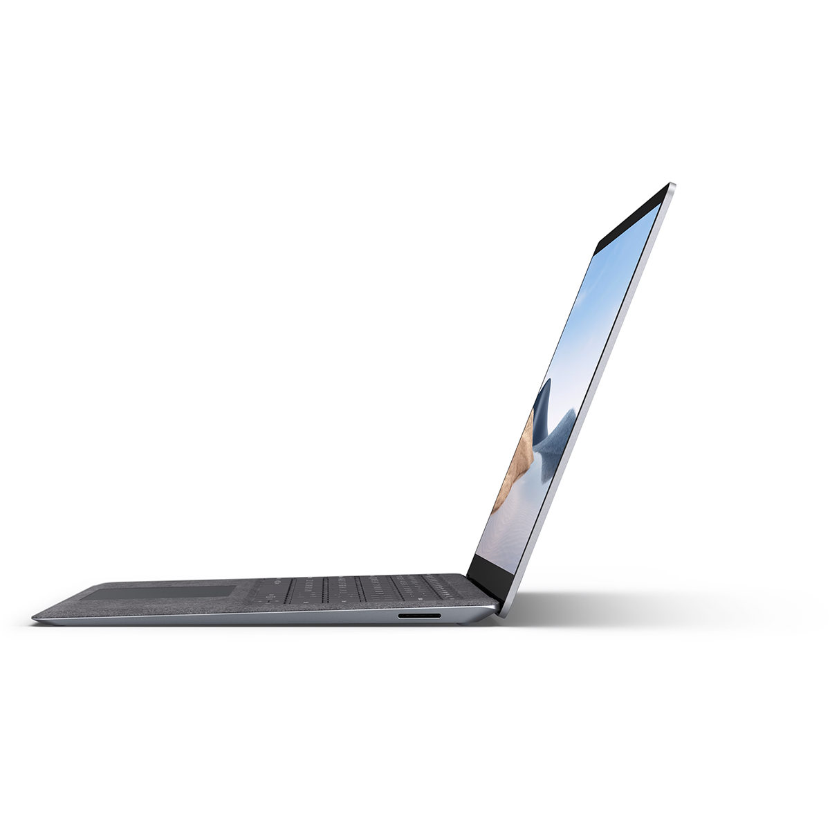 A gray laptop is open, angled towards the viewer. The screen displays an image. The background is white.