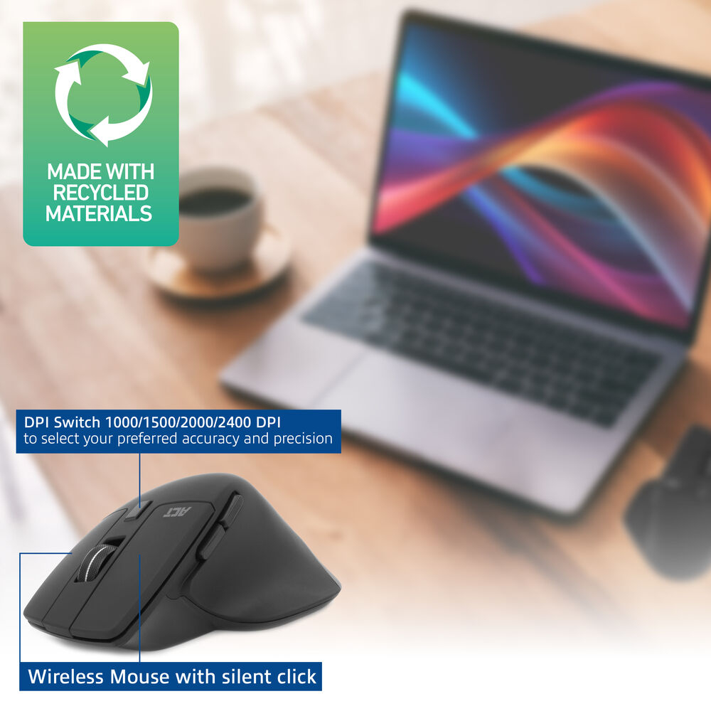 A black wireless mouse, a laptop, and a coffee cup on a wooden surface. A green sign says 'Made with recycled materials'.