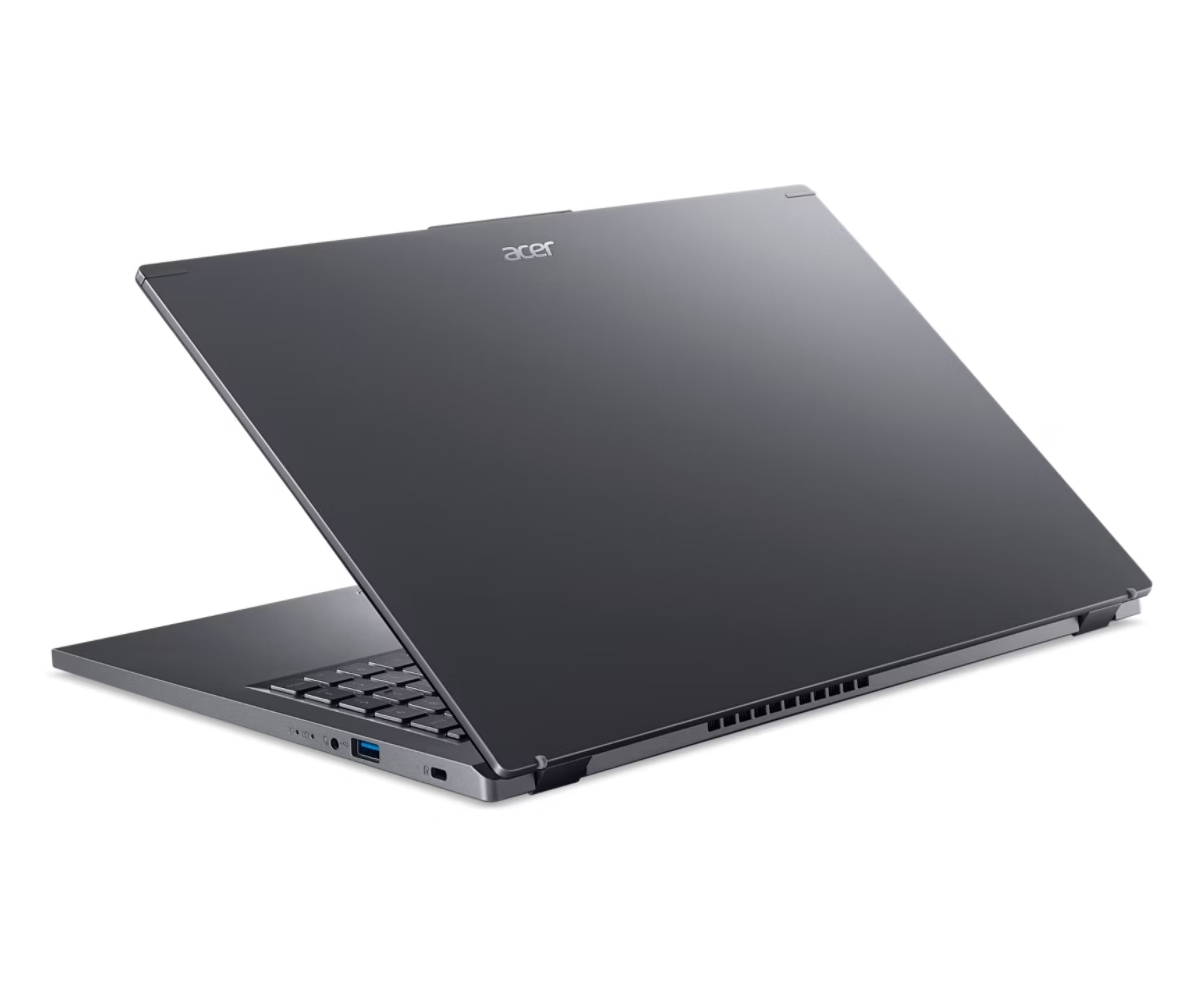 Un laptop Acer grigio scuro è aperto, mostrando tastiera e schermo. Il logo Acer è visibile in alto sullo schermo.