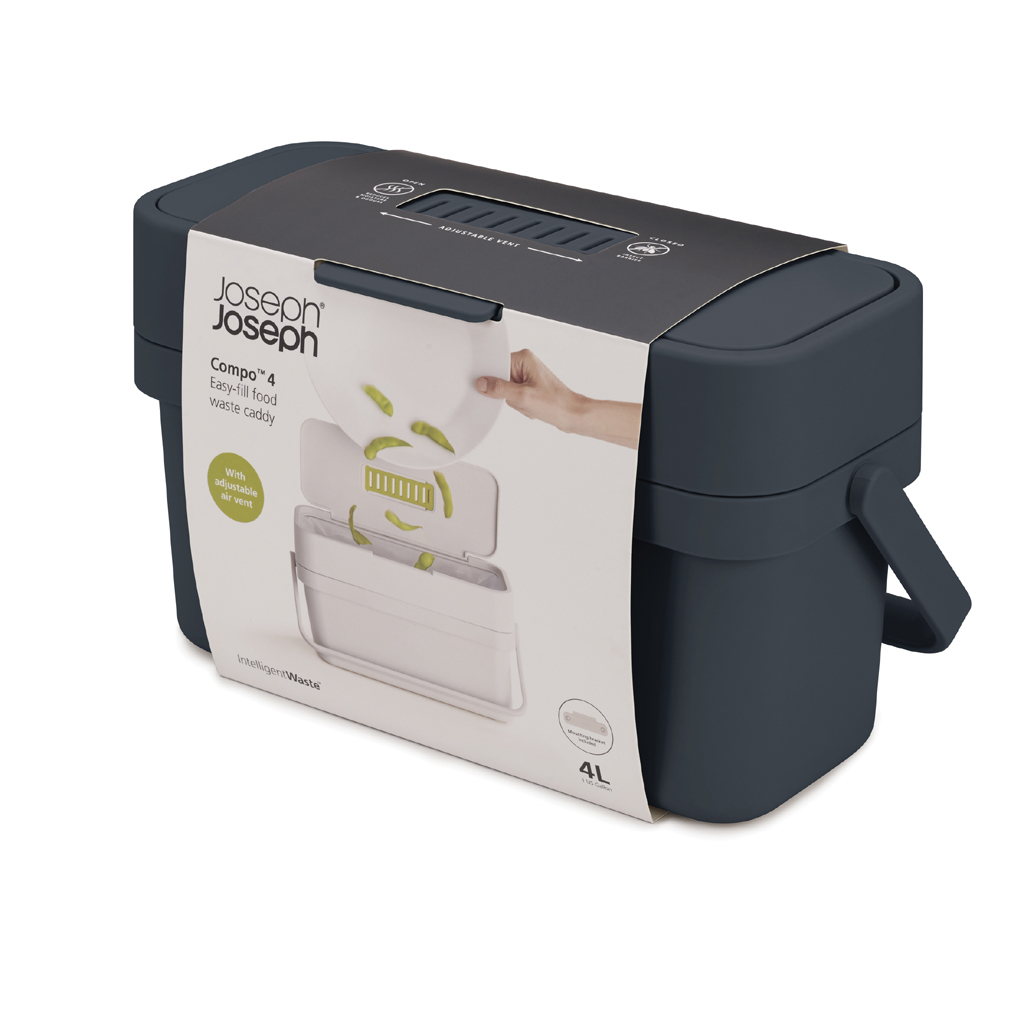 Un cubo de basura para alimentos Joseph Joseph Compo 4 gris oscuro con un contenedor interno blanco, capacidad de 4L y una mano dejando caer comida.