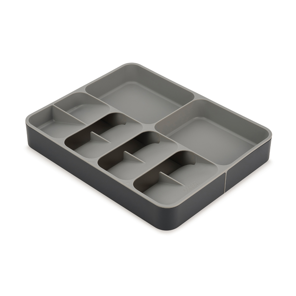 Bandeja de cubiertos de plástico gris y gris oscuro con múltiples compartimentos. Para organizar el cajón de la cocina.