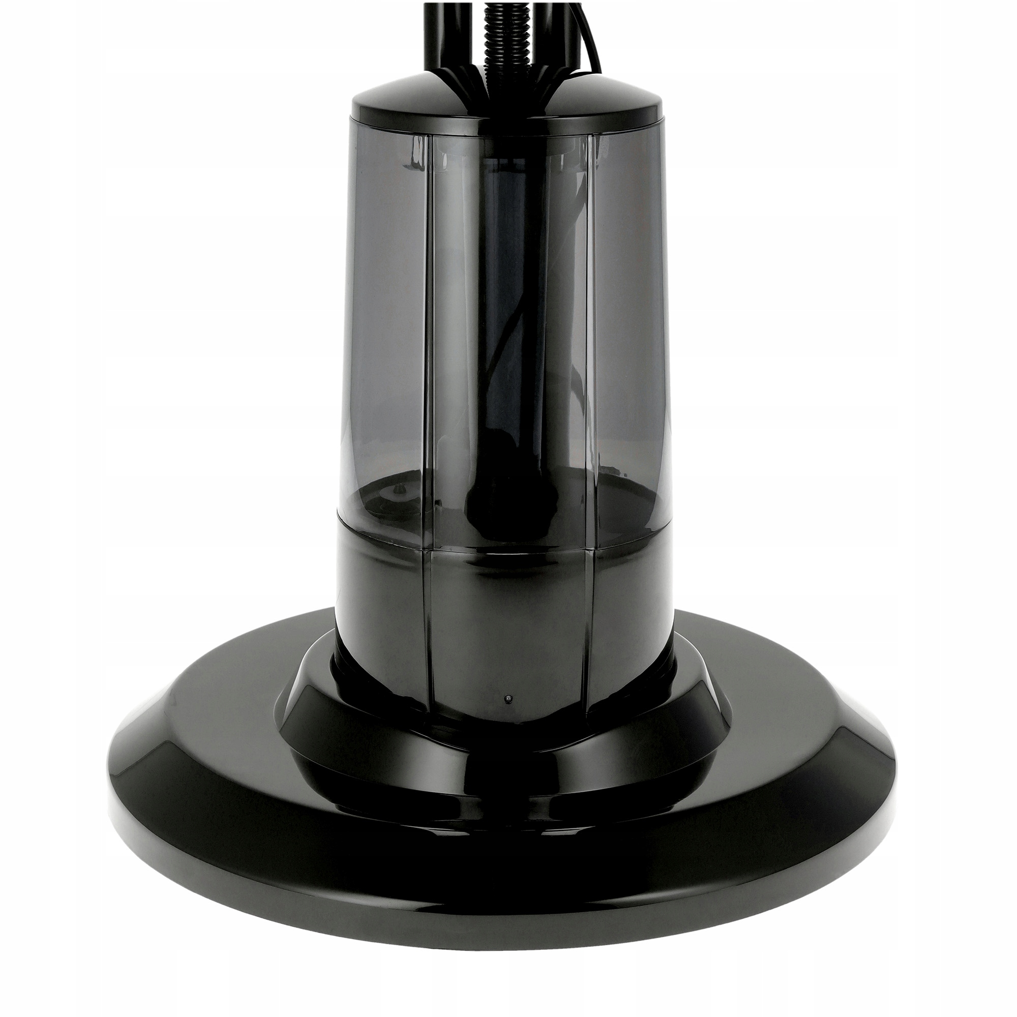 Zbliżenie czarnej podstawy wentylatora. Cylindryczny, przezroczysty fragment spoczywa na szerokiej, okrągłej podstawie.