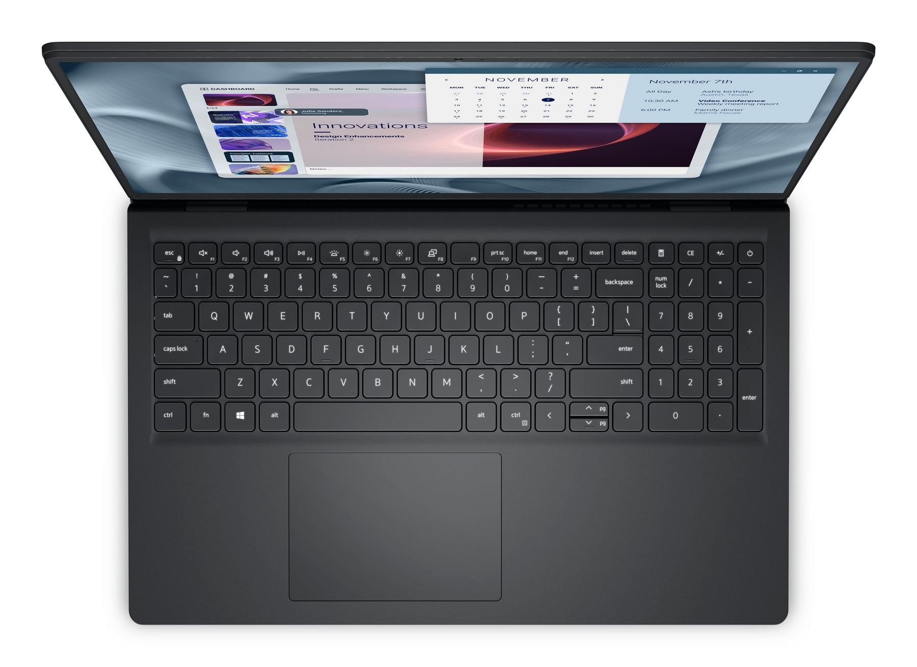 Un laptop aperto, che mostra un calendario e una dashboard. La tastiera è visibile. Lo schermo mostra una conferenza e un calendario.