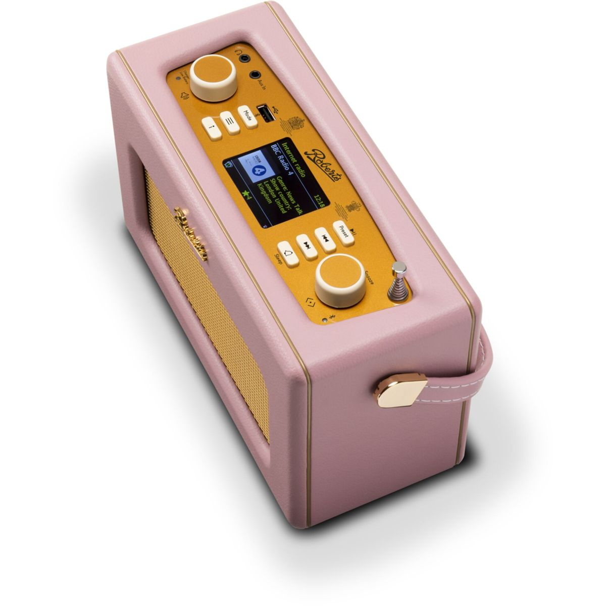 Różowe radio retro ze złotą maskownicą głośnika i elementami sterującymi. Ekran wyświetla 'BBC Radio 4'. Widoczny uchwyt i pokrętła.