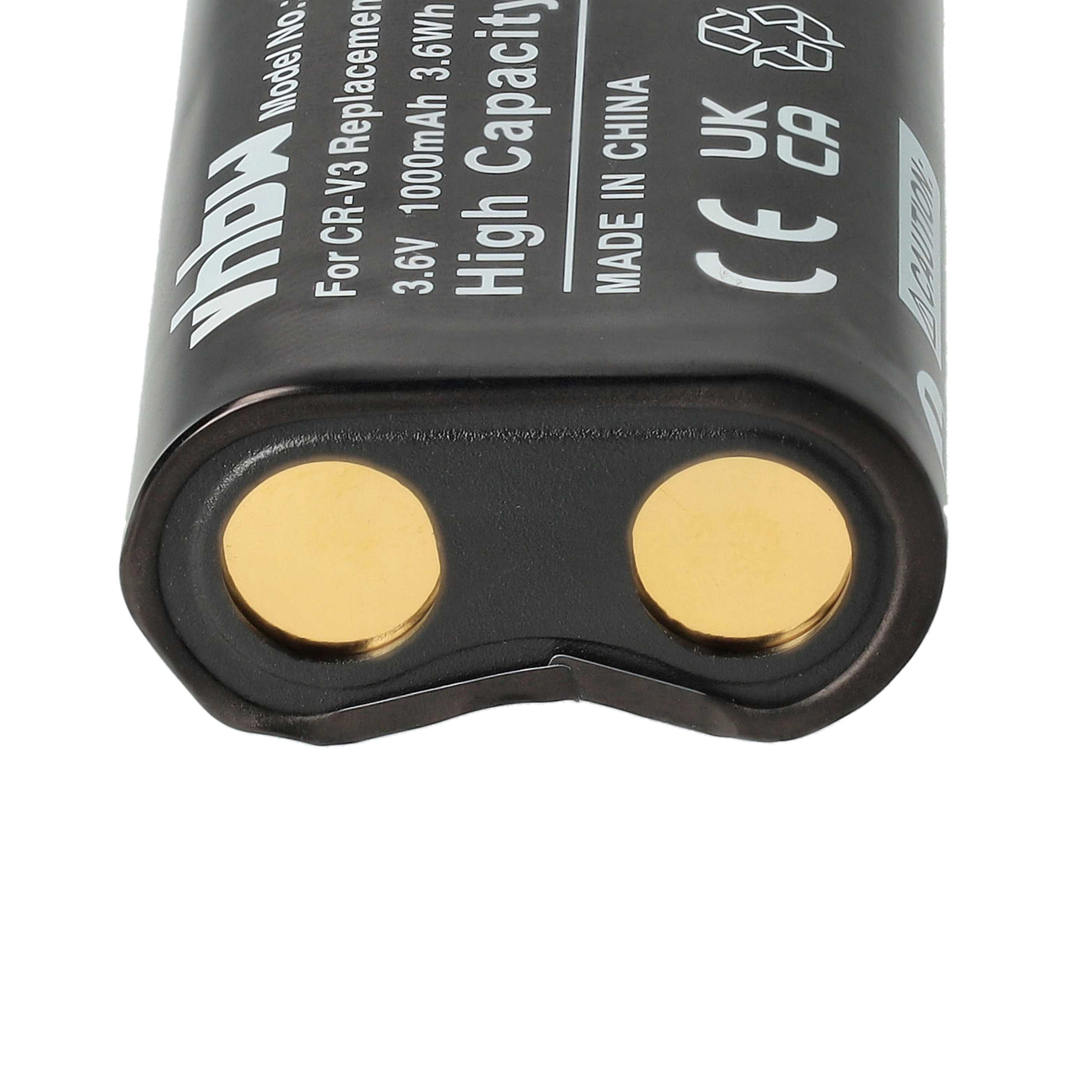 Nahaufnahme einer schwarzen Batterie mit zwei goldfarbenen Kontaktpunkten und weißem Text.