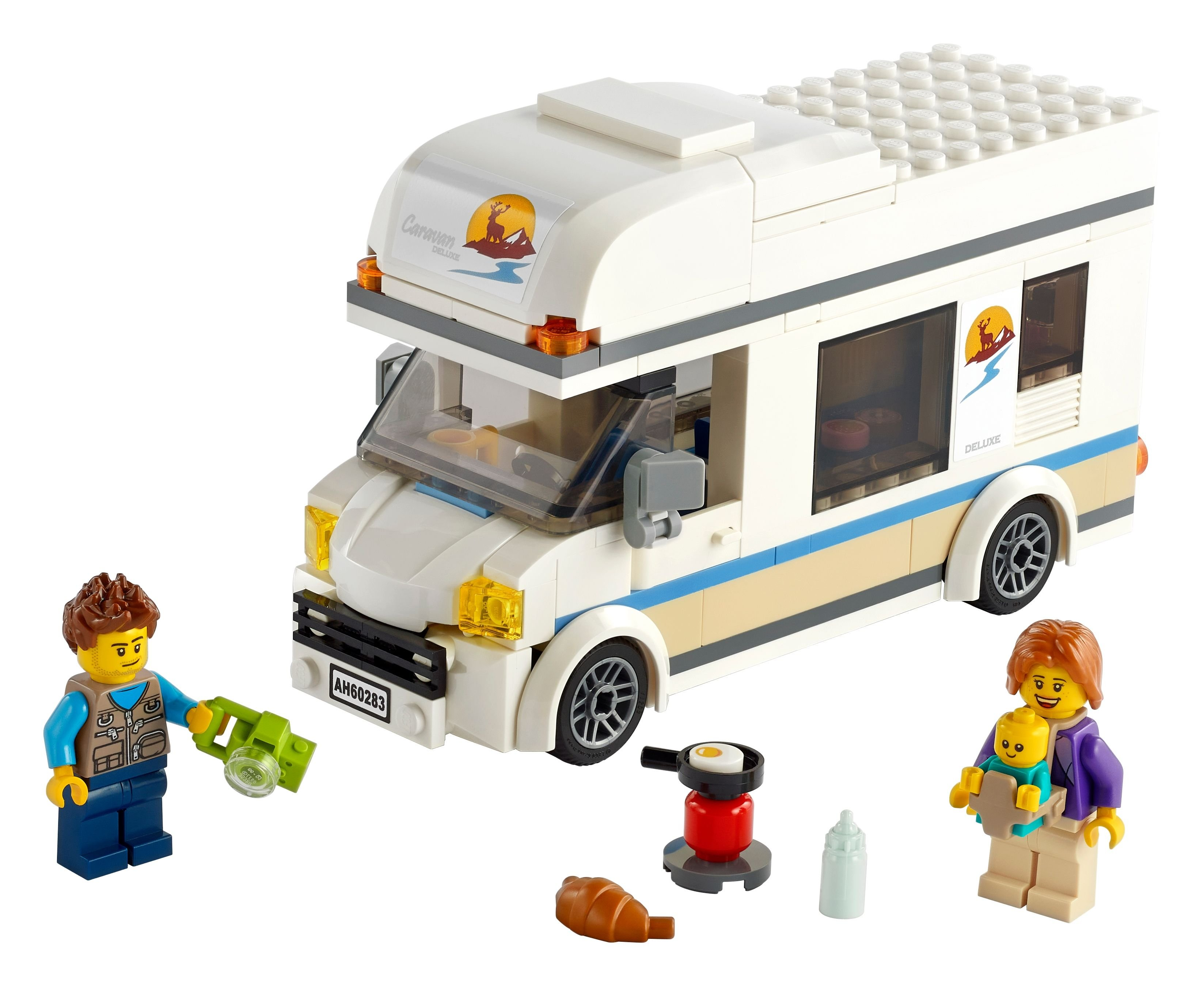 Un camper Lego bianco con personaggi, una padella, pane e un biberon.