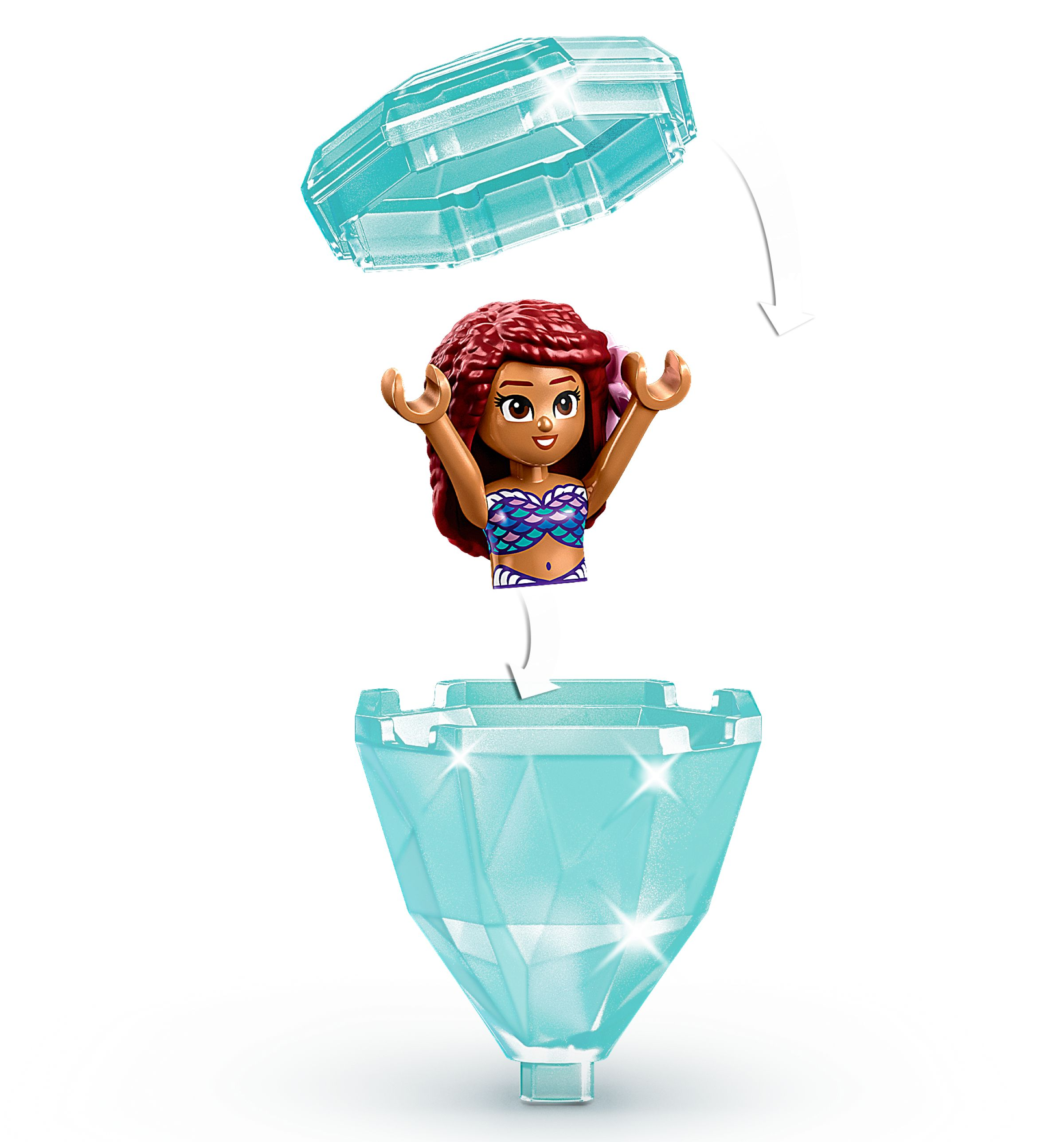 Eine LEGO-Meerjungfrau-Figur kommt aus einem rautenförmigen Behälter. Der Behälter ist türkis und hat einen Klappdeckel.