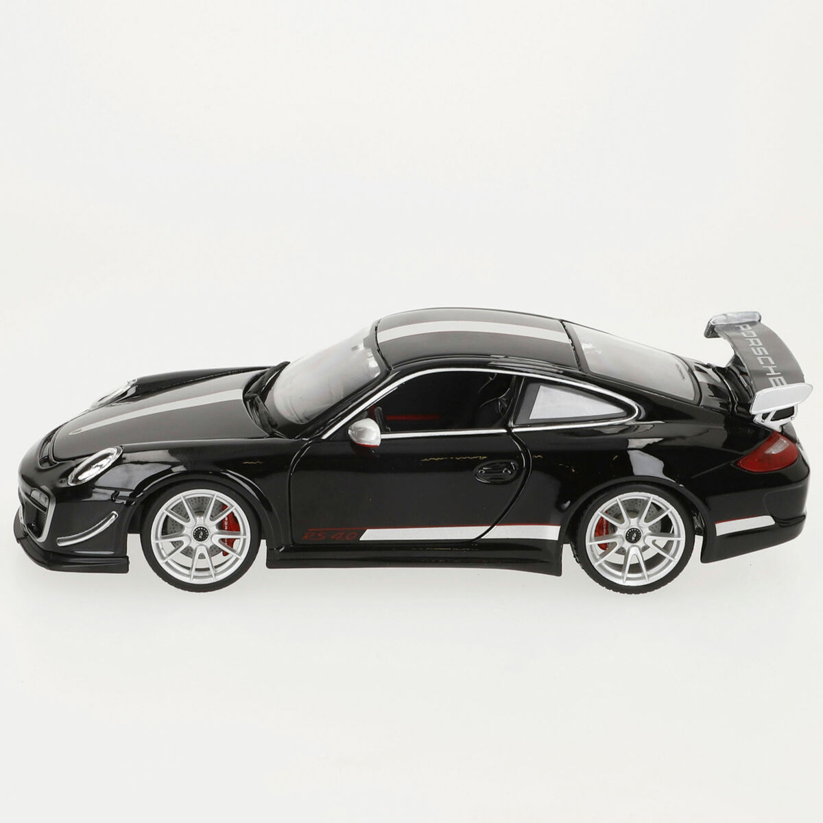 Ein schwarzes Porsche 911 GT3 RS 4.0 Modellauto mit weißen Streifen. Es hat einen Heckflügel und rote Bremssättel.