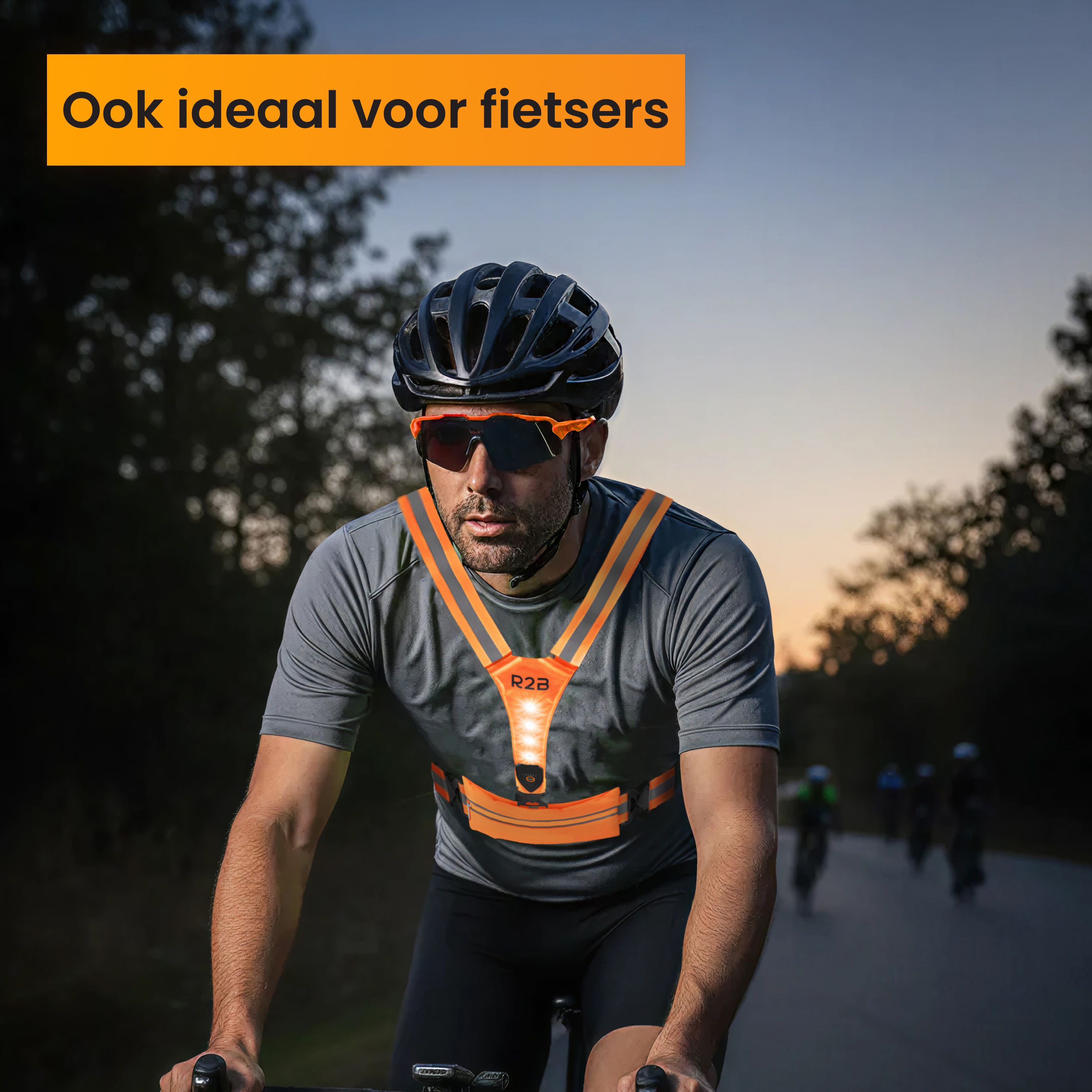 Cyclist with helmet and safety vest, cycling on a road. Background shows other cyclists and trees at sunset.