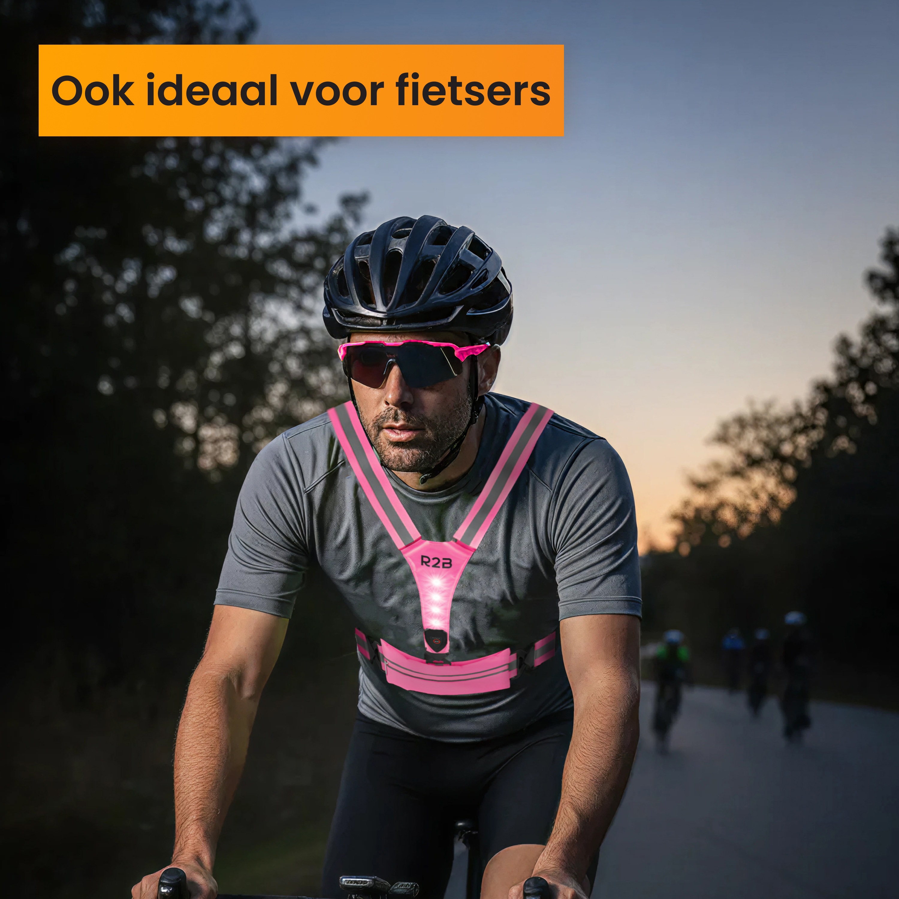 Cyclist wearing helmet, glasses, and a pink safety vest. Background shows a road and other cyclists. Text: Ideal for cyclists.