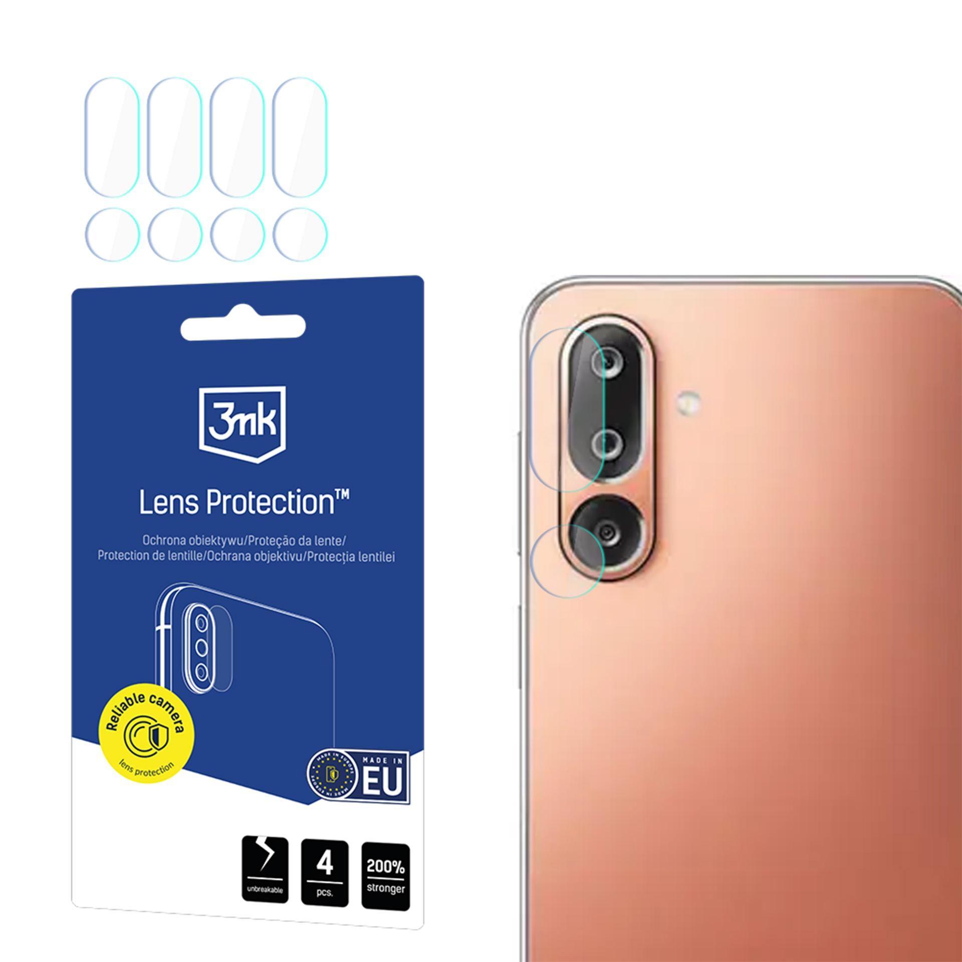 Un kit di protezione per lenti del telefono con più pezzi di pellicola, un telefono con fotocamera e confezione con informazioni sul prodotto.