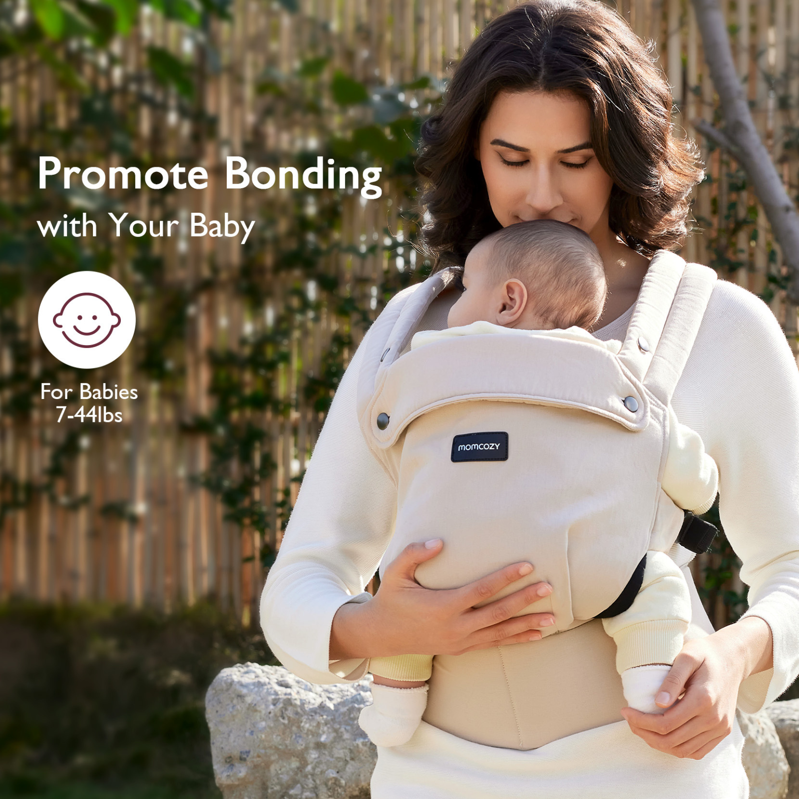 A woman holds a baby in a beige baby carrier. The text says 'Promote Bonding' and 'For Babies 7-44lbs'.