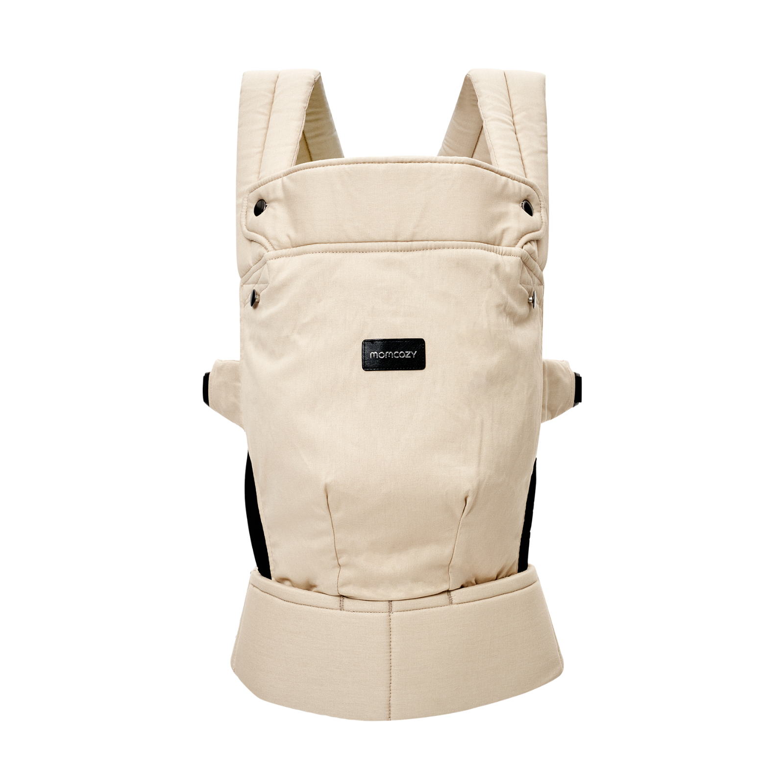 Beige baby carrier with black accents. Features shoulder straps, a front pouch, and the brand name momcozy.
