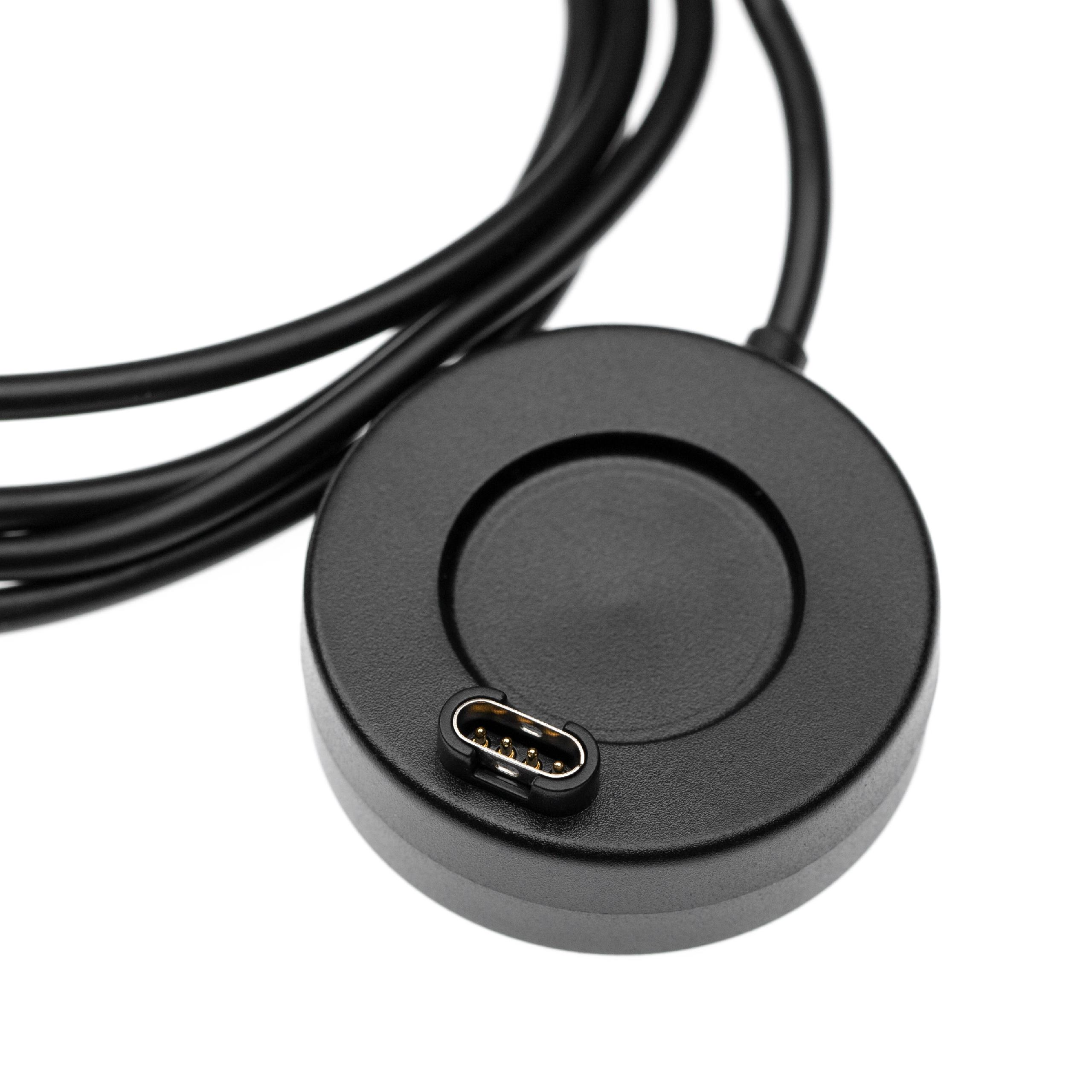 Ein schwarzes kreisförmiges Ladegerät mit USB-Anschluss. Ein schwarzes Kabel ist am Dock befestigt.