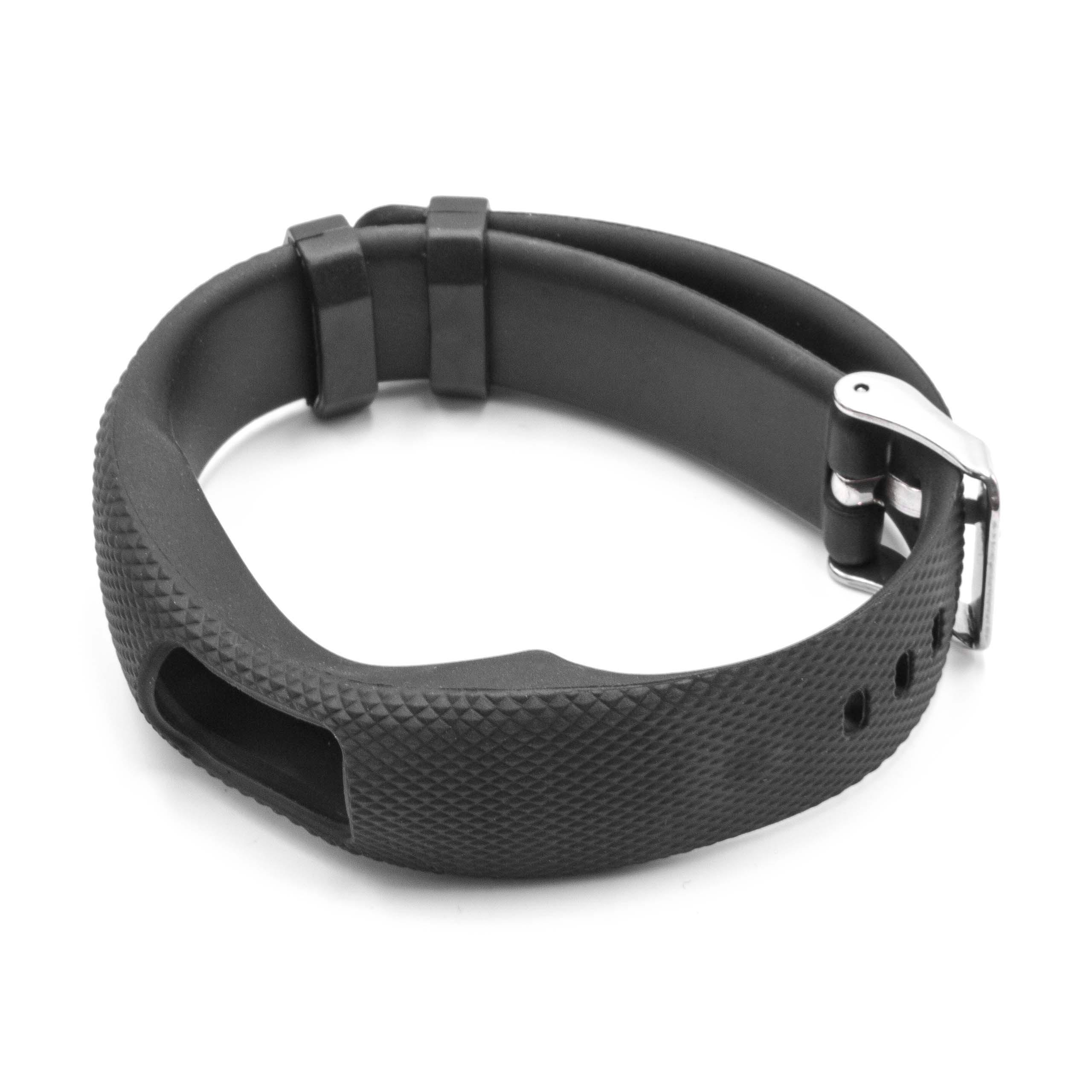 Ein schwarzes Fitness-Tracker-Armband liegt auf einer weißen Oberfläche. Es hat eine strukturierte Oberfläche mit silberner Schließe.