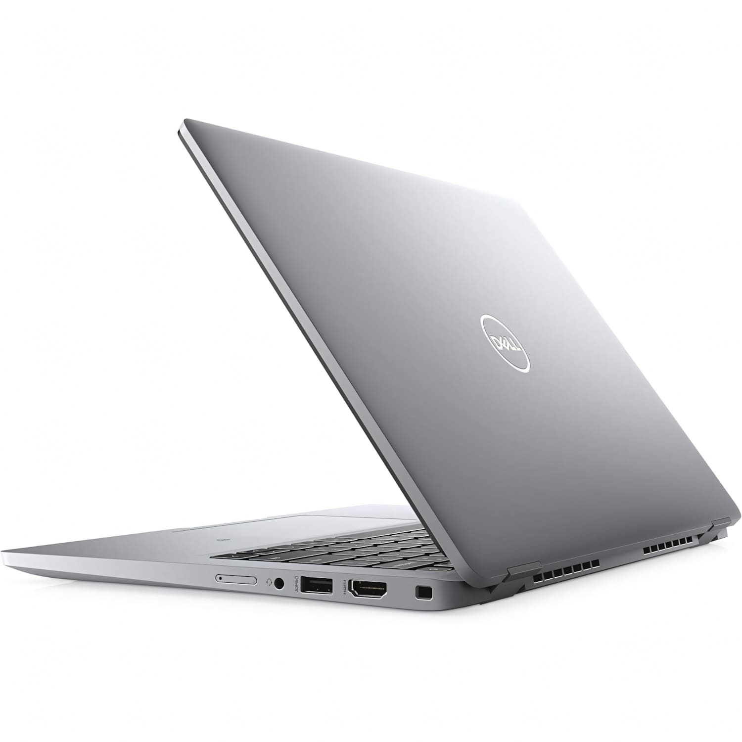 Un portátil Dell plateado está abierto, mostrando el teclado. La pantalla está inclinada hacia atrás. El fondo es blanco.