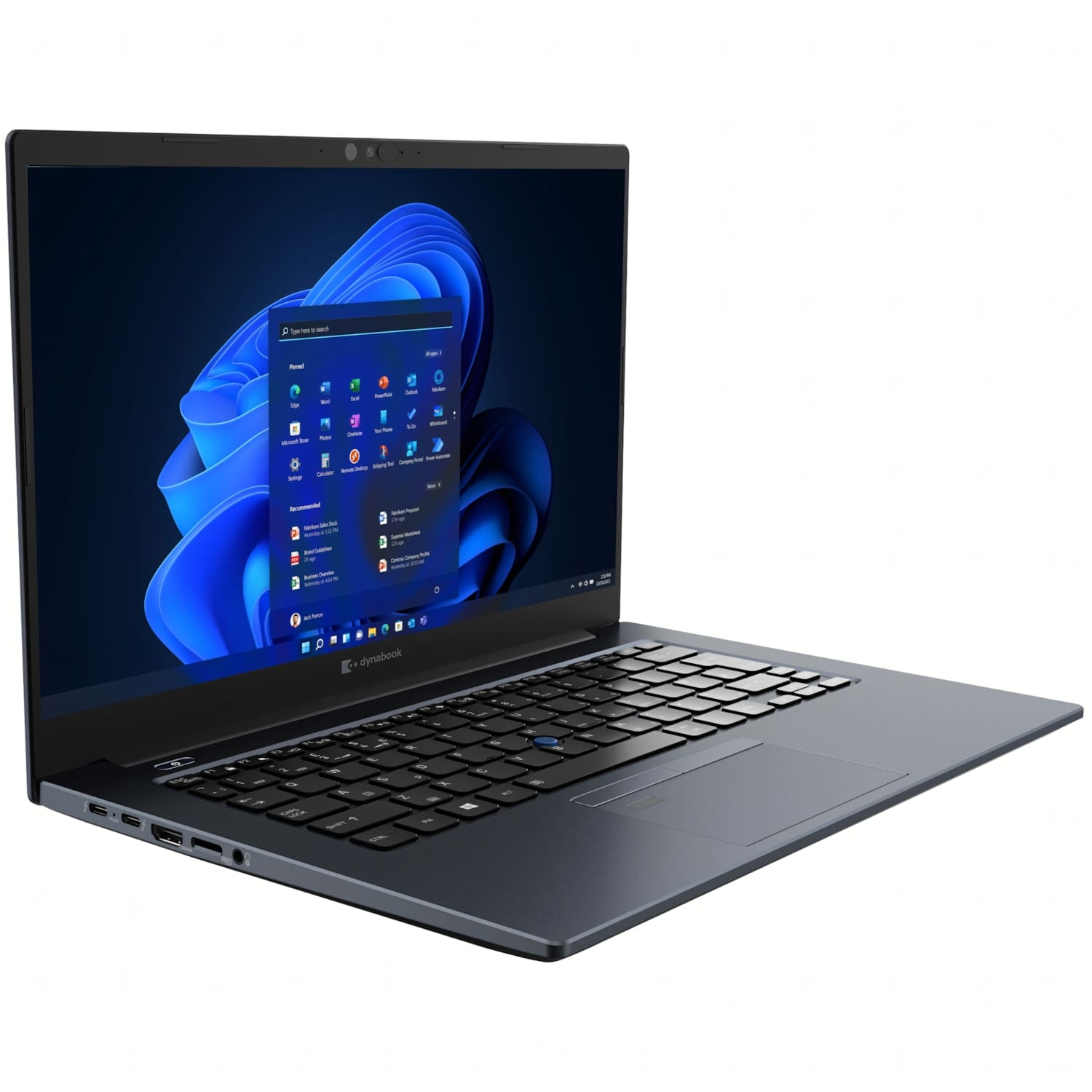Un portátil Dynabook gris oscuro está abierto, mostrando la interfaz de Windows 11. La pantalla muestra iconos de aplicaciones, con un teclado negro visible.