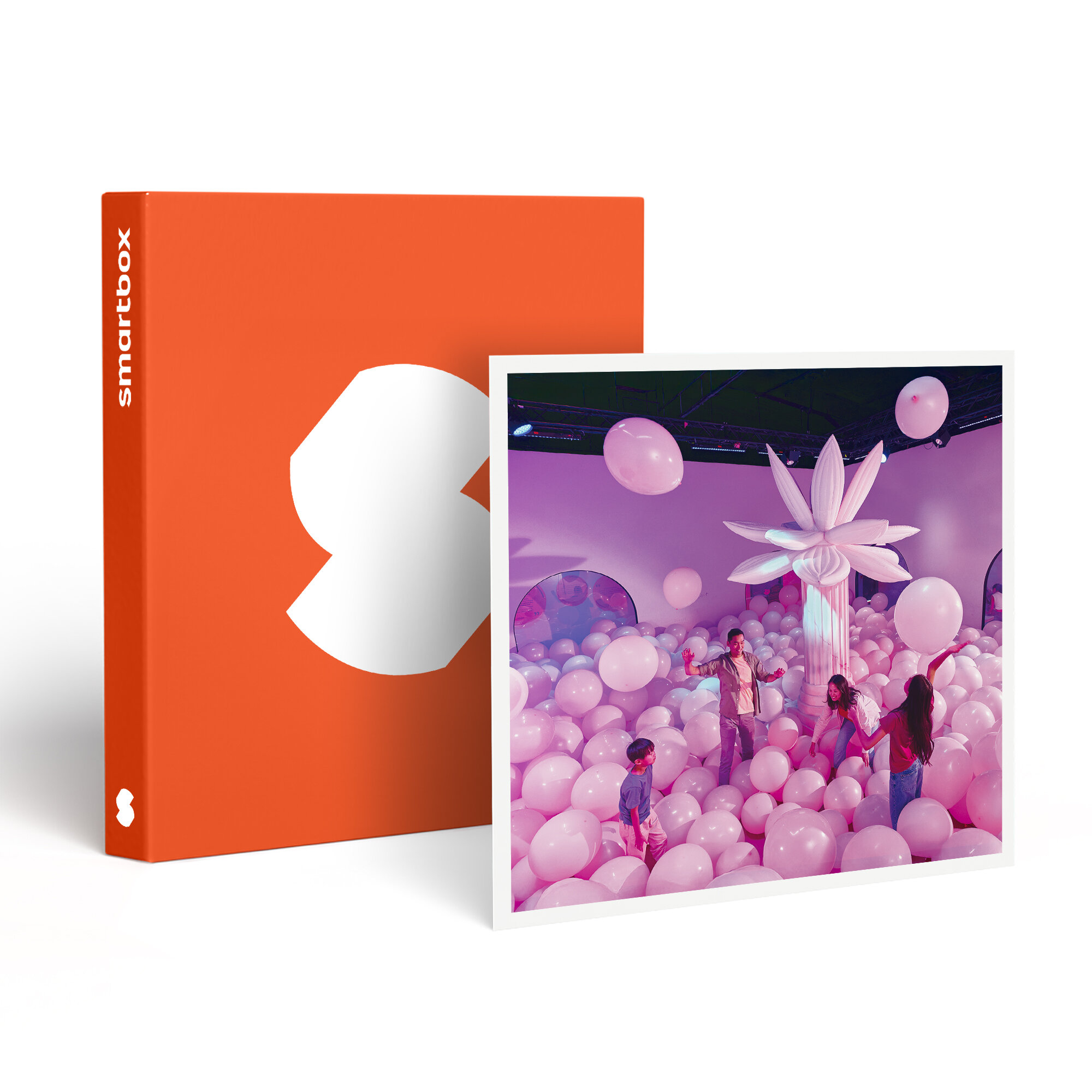 Un Smartbox naranja y una foto. La foto muestra personas en una habitación llena de globos rosas y una flor blanca.