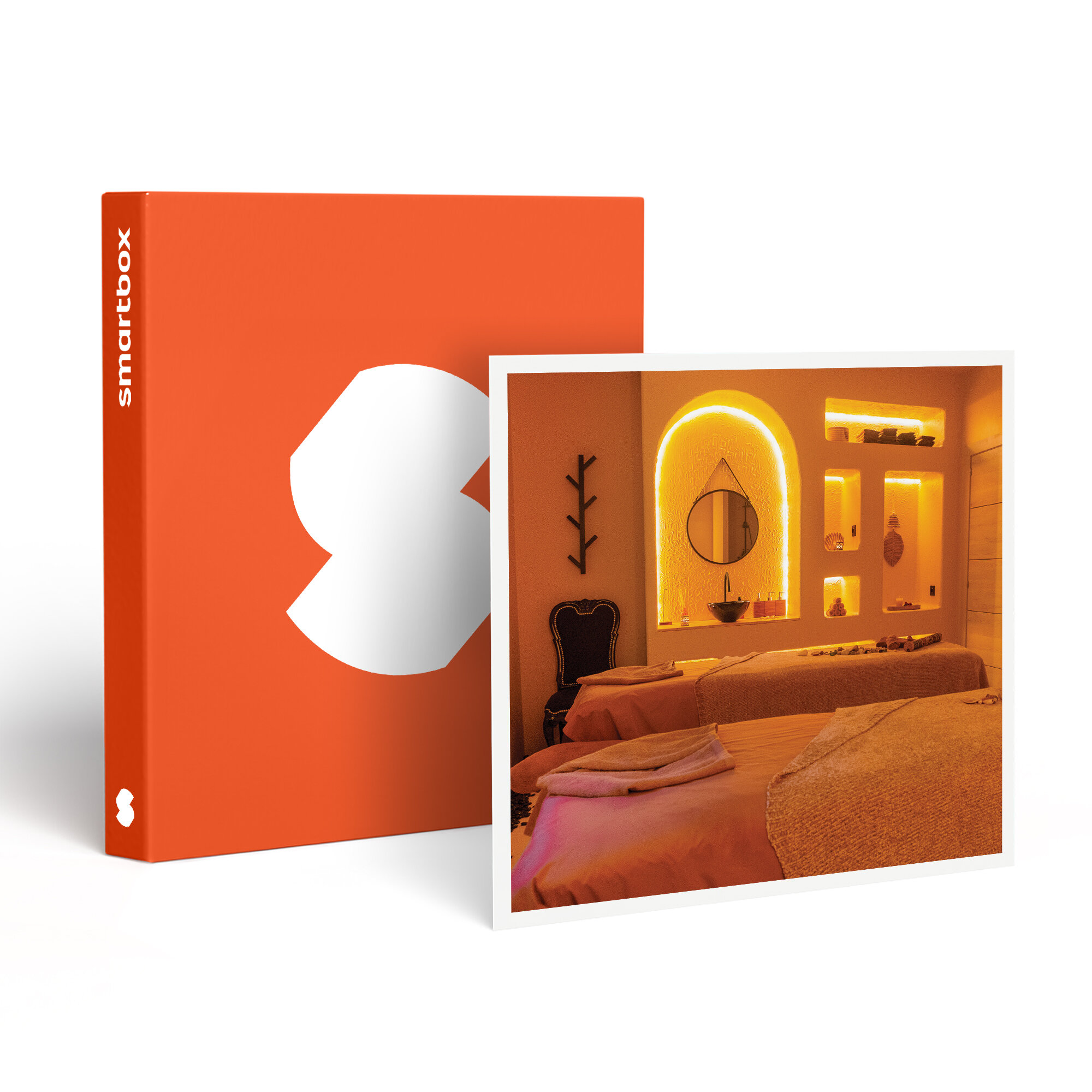 Una Smartbox naranja y foto de un spa. La habitación tiene camas y un espejo. La Smartbox tiene un logo blanco.