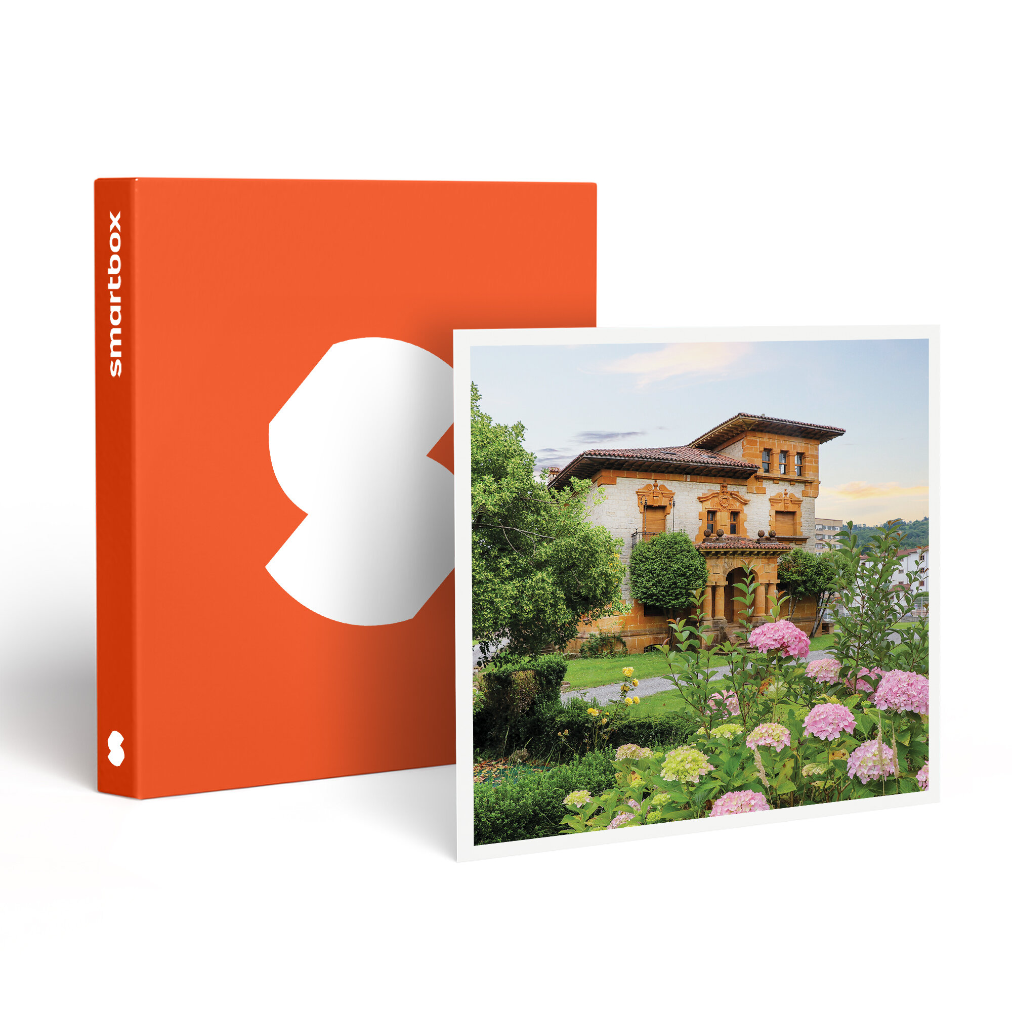 Una Smartbox naranja junto a una foto enmarcada. La foto muestra una casa, un jardín y flores.