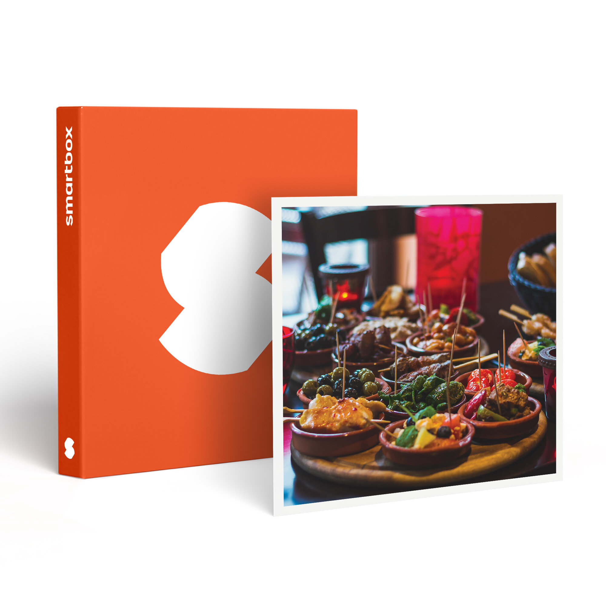 Una Smartbox naranja junto a una foto. La foto muestra tapas en cuencos pequeños con aceitunas, carne y verduras.