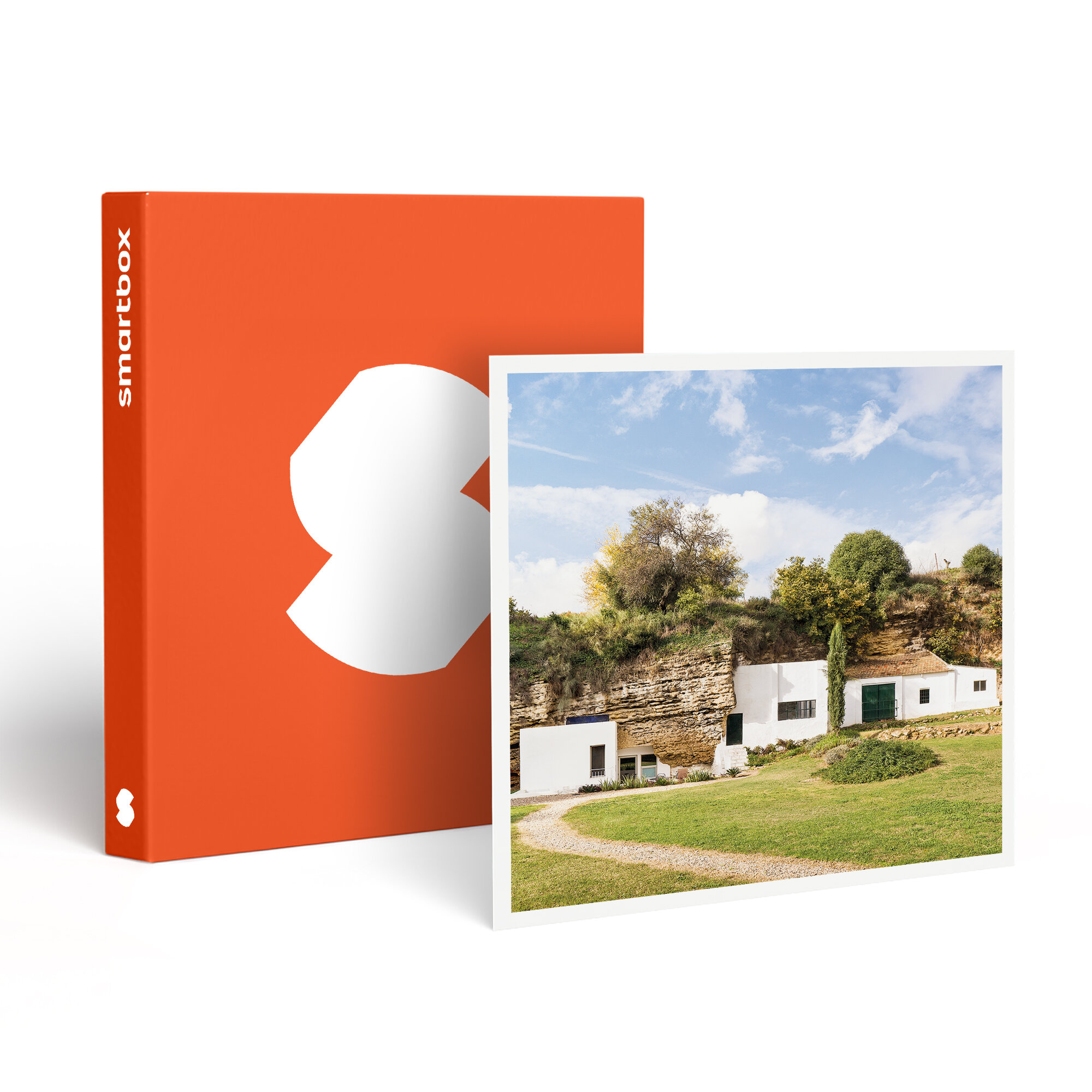 Un Smartbox naranja junto a una foto. La foto muestra edificios blancos en una colina verde bajo un cielo azul.
