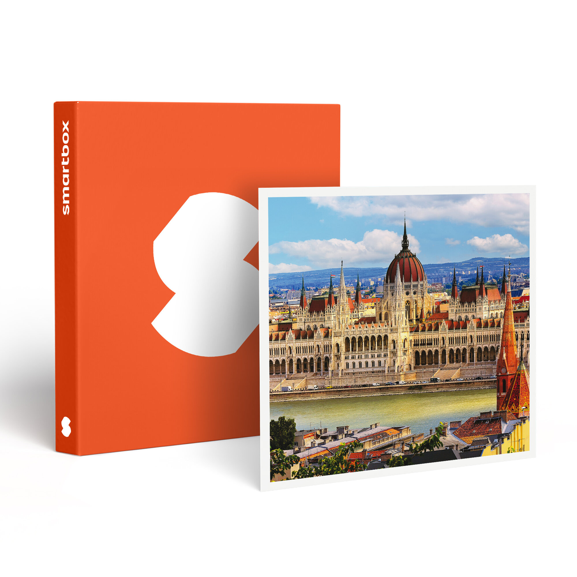 Una caja naranja con una forma blanca junto a una foto enmarcada de un edificio grande con un río enfrente.