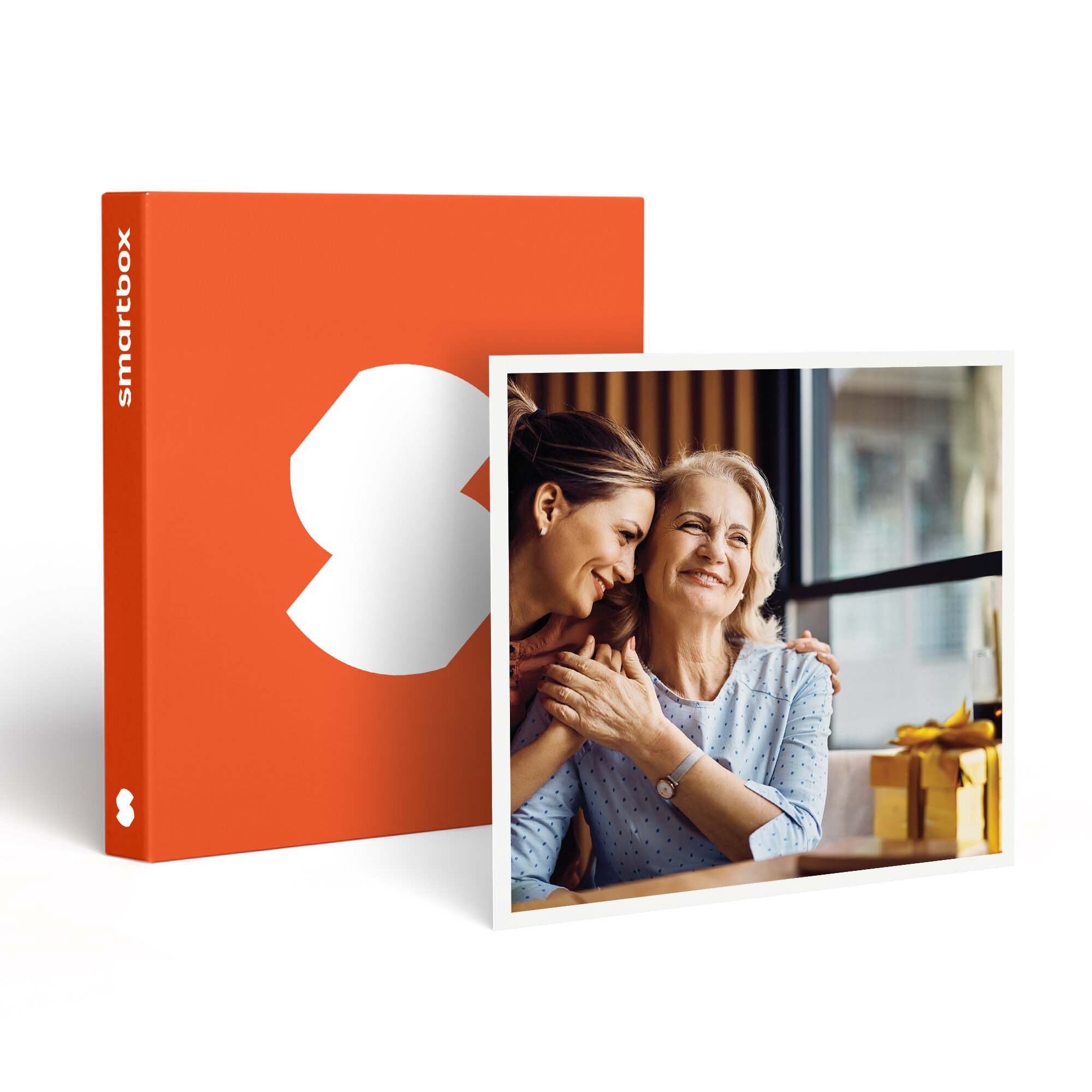 Una Smartbox naranja junto a una foto. La foto muestra a una mujer joven abrazando a una mujer mayor, ambas sonriendo.