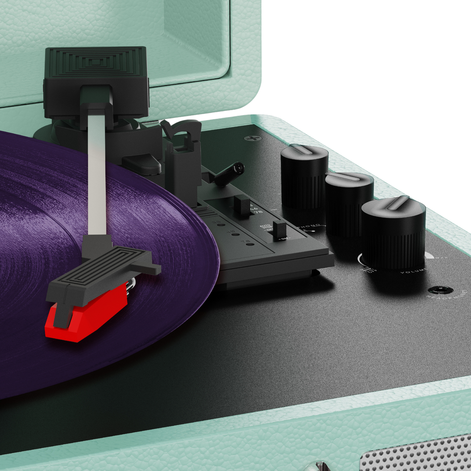 Giradischi con vinile viola, componenti neri, puntina rossa e custodia turchese. Manopole e interruttori visibili.