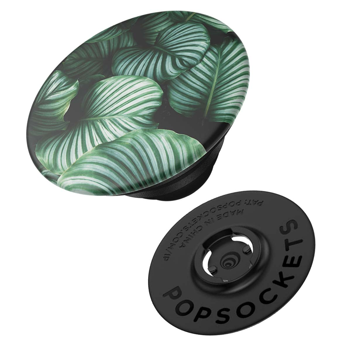 Ein PopSockets-Handygriff. Die Oberseite hat ein Blattdesign mit grünen und weißen Blättern. Die Basis ist schwarz mit der Aufschrift 'POPSOCKETS'.