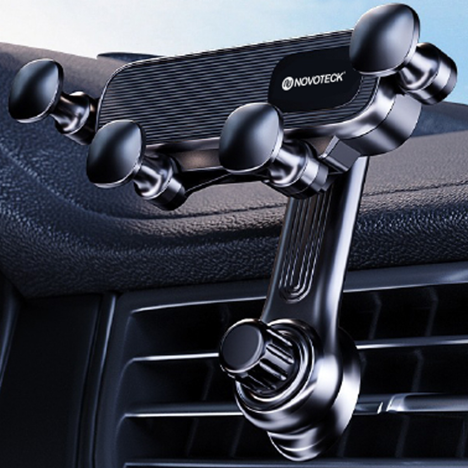 Soporte para teléfono de coche montado en la rejilla de ventilación del salpicadero. Soporte negro con logo Novoteck.