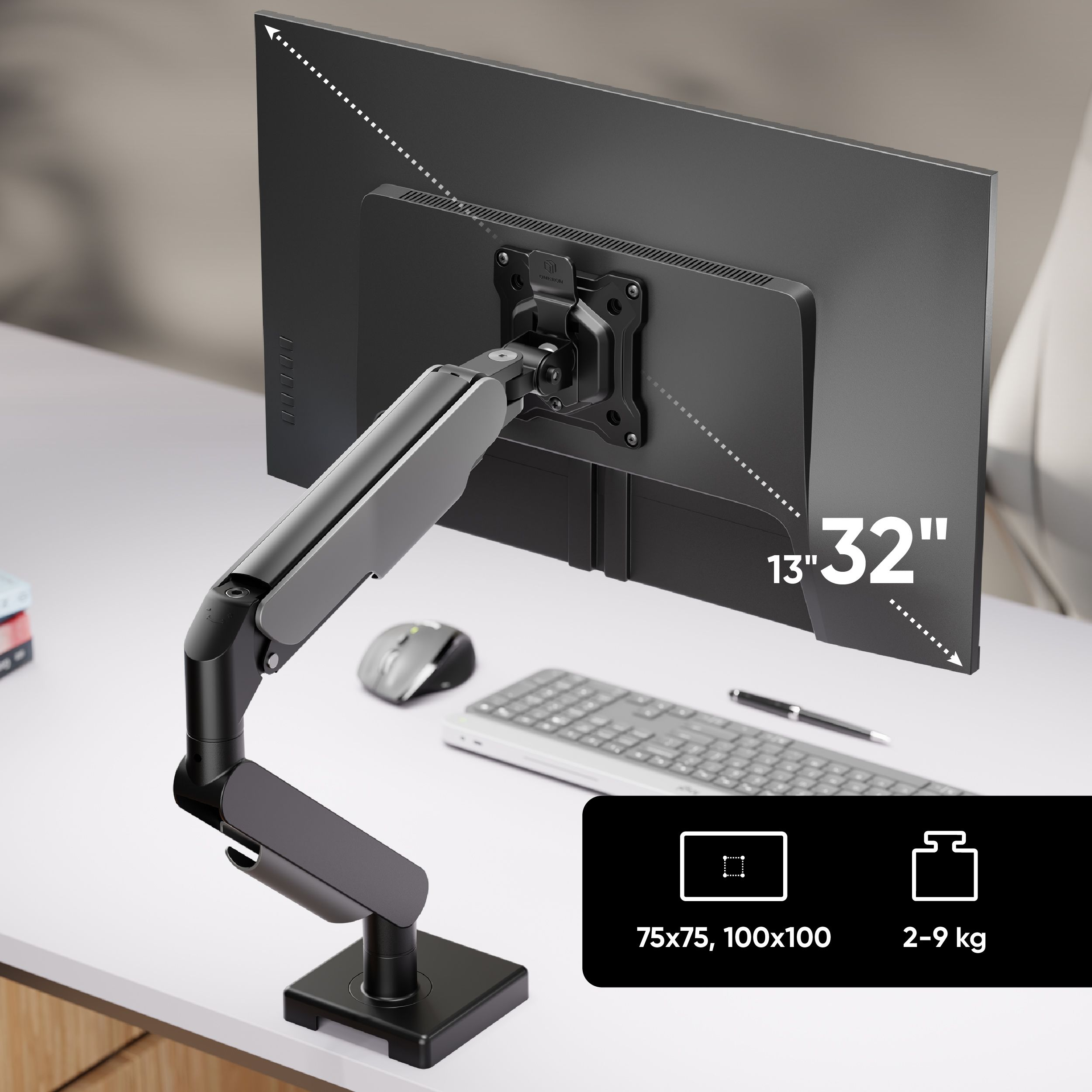 Ramię monitora podtrzymuje ekran. Mysz i klawiatura są na stole. Infografiki pokazują wymiary i wagę.