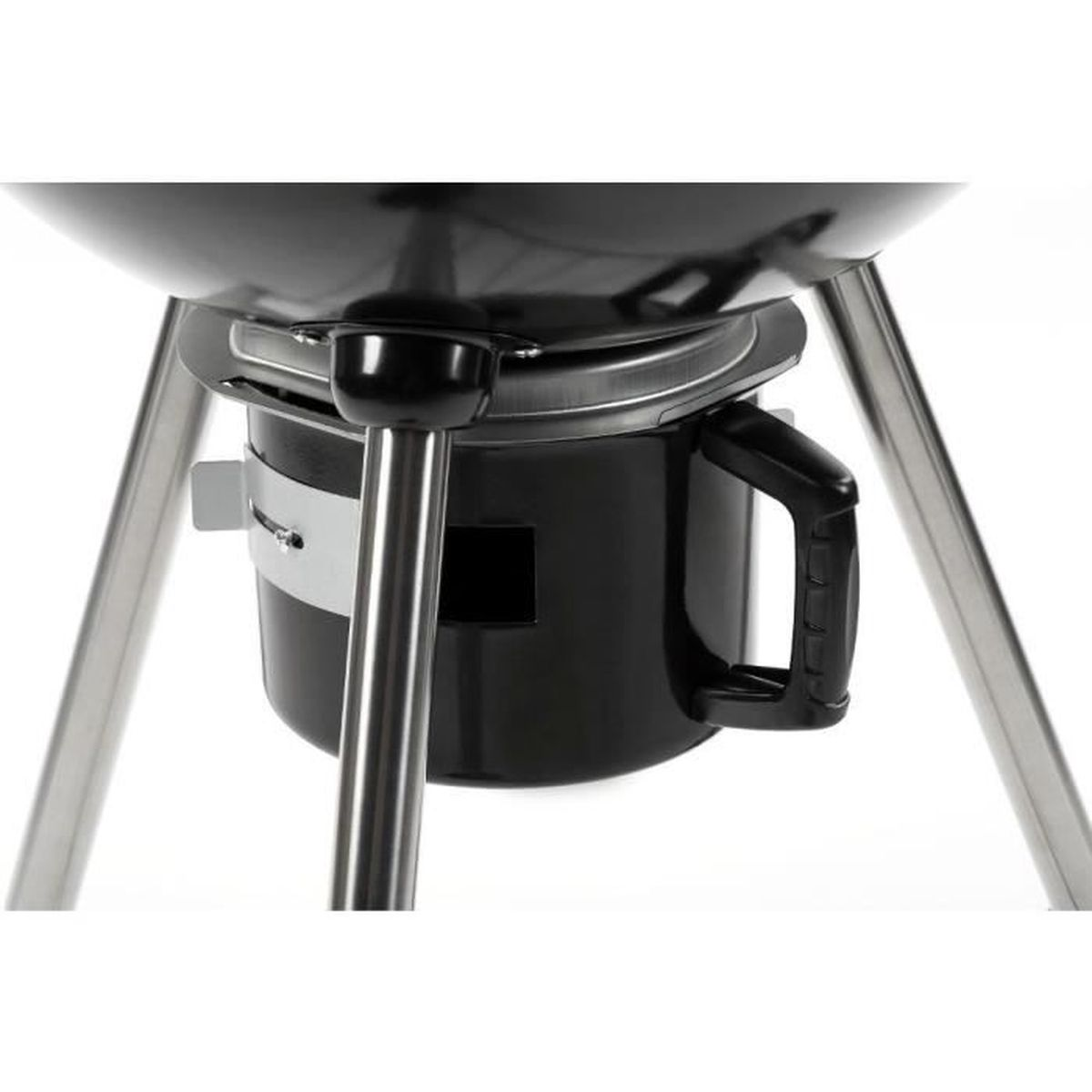 Close-up of a black kettle grill. It has a rounded lid, a black body, and a black handle. Stainless steel legs support it.