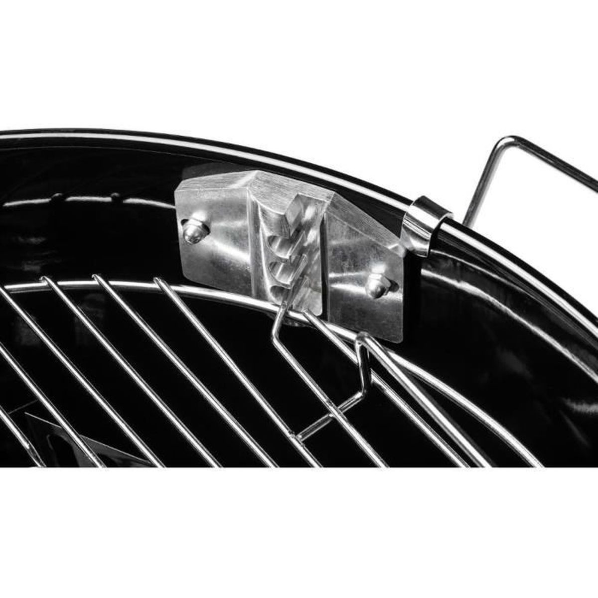 Close-up of a grill. Metal grill grate and black bowl. A metal bracket holds the grate in place.