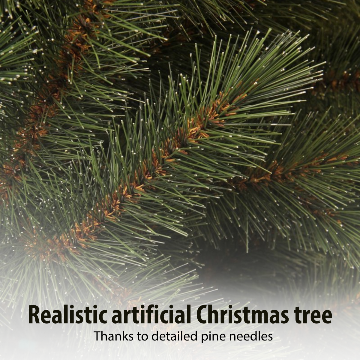 Close-up of a realistic artificial Christmas tree. Green needles with brown tips are visible. The image shows a close view of the tree.