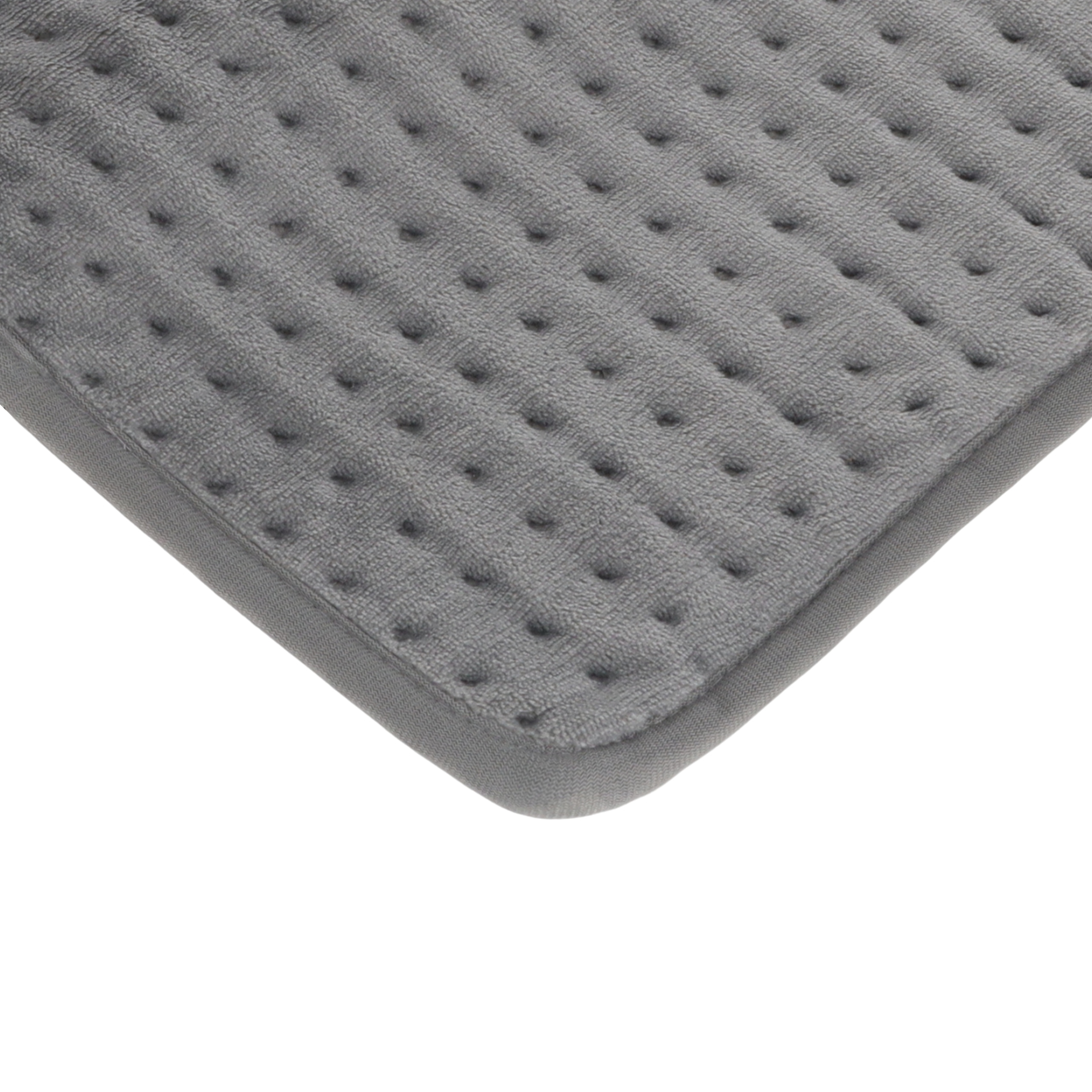 Szara, pikowana poduszka grzewcza z zaokrągloną krawędzią na białym tle.