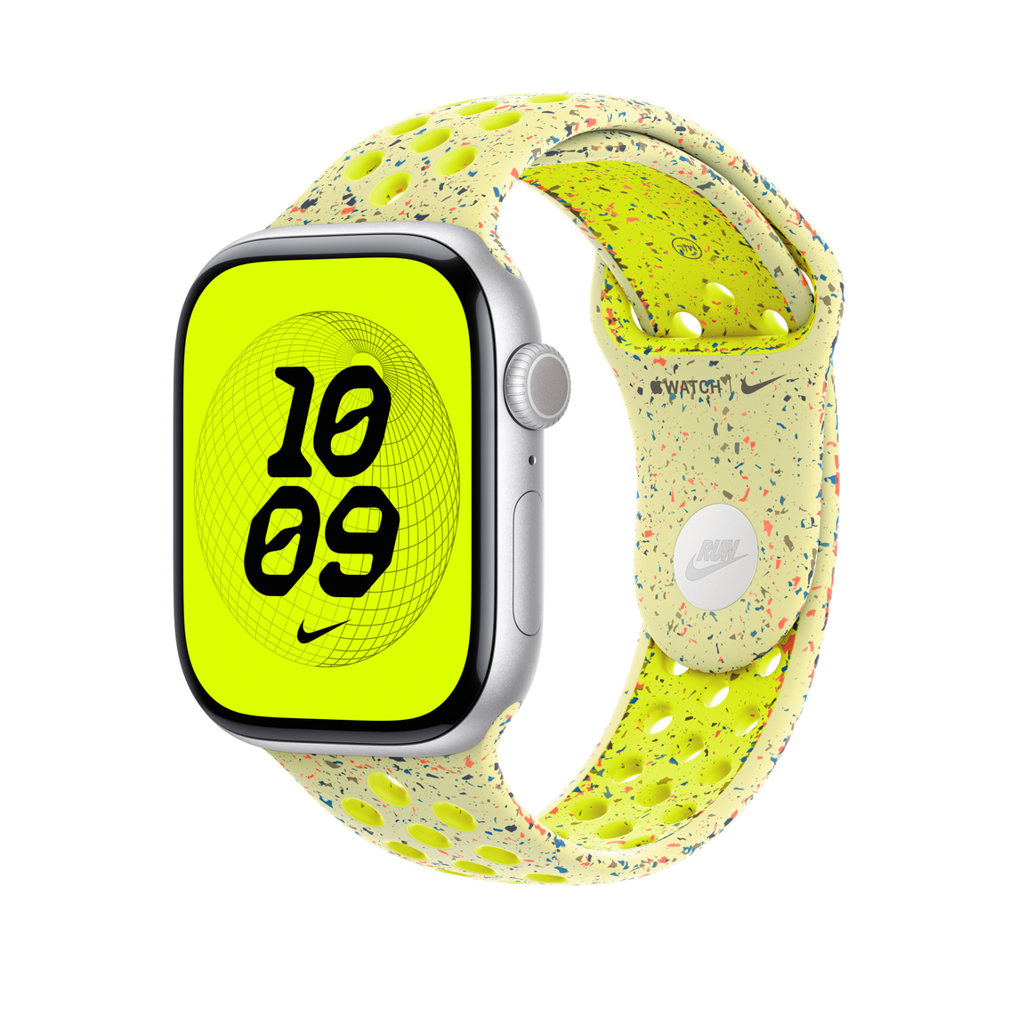Apple Watch con cinturino giallo. Il quadrante mostra l'ora 10:09. Il cinturino ha il logo Nike ed è macchiato di punti colorati.