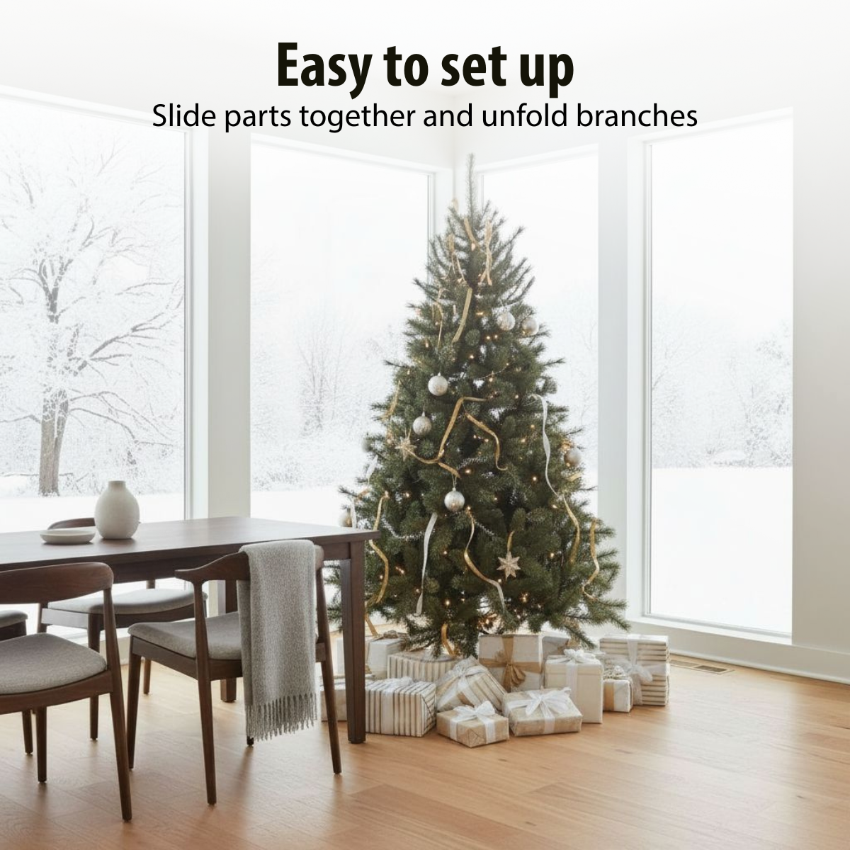A decorated Christmas tree stands in front of a window. Presents are beneath it. A dining table and chairs are in front.