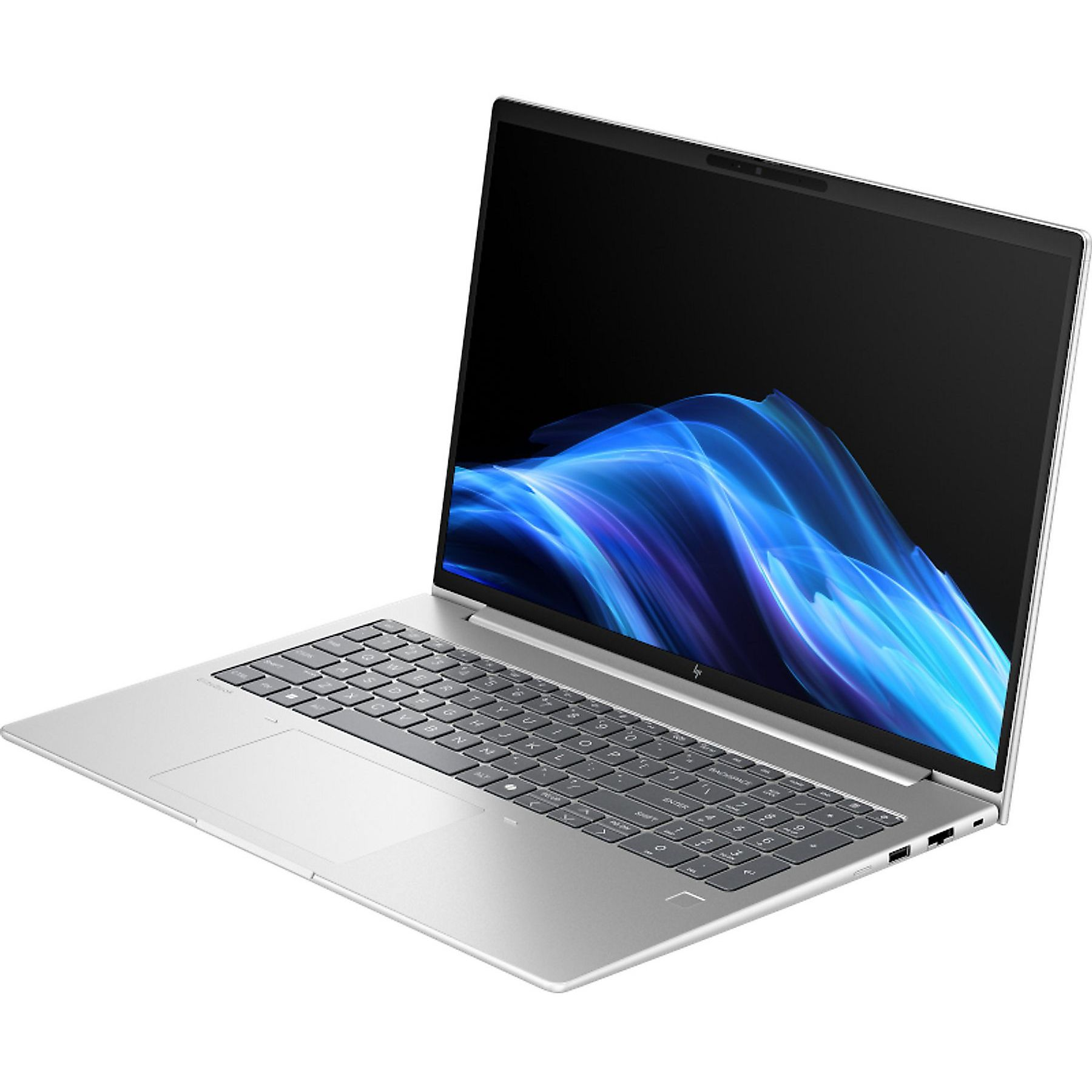 Laptop argentato con schermo nero che mostra arte astratta blu. Tastiera visibile. Il laptop è su una superficie bianca.